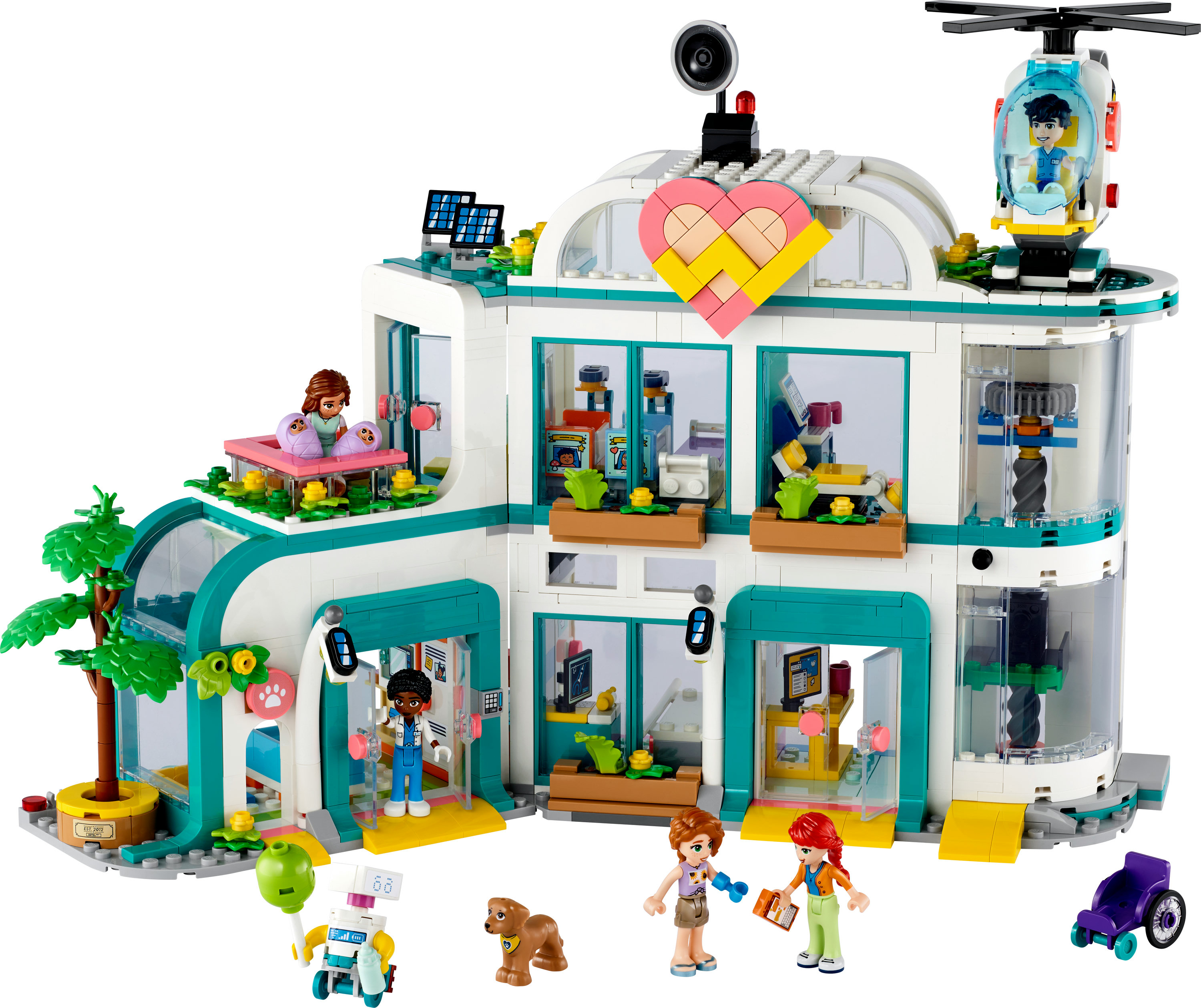 Zestaw Lego Friends z kliniką weterynaryjną z różnymi pomieszczeniami, minifigurkami i zwierzętami.