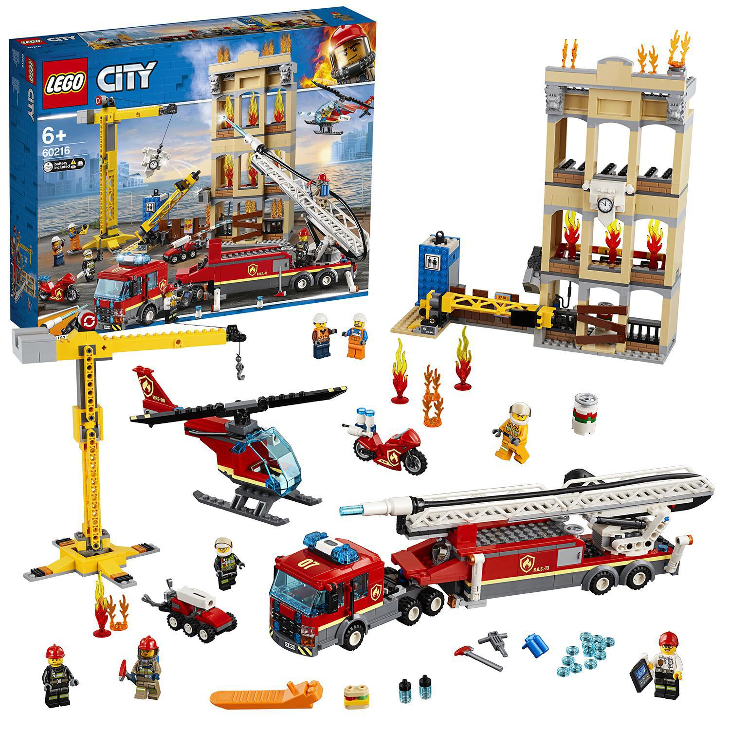 Set Lego City. Una caserma dei pompieri, autopompe, un elicottero e diversi personaggi sono in mostra.