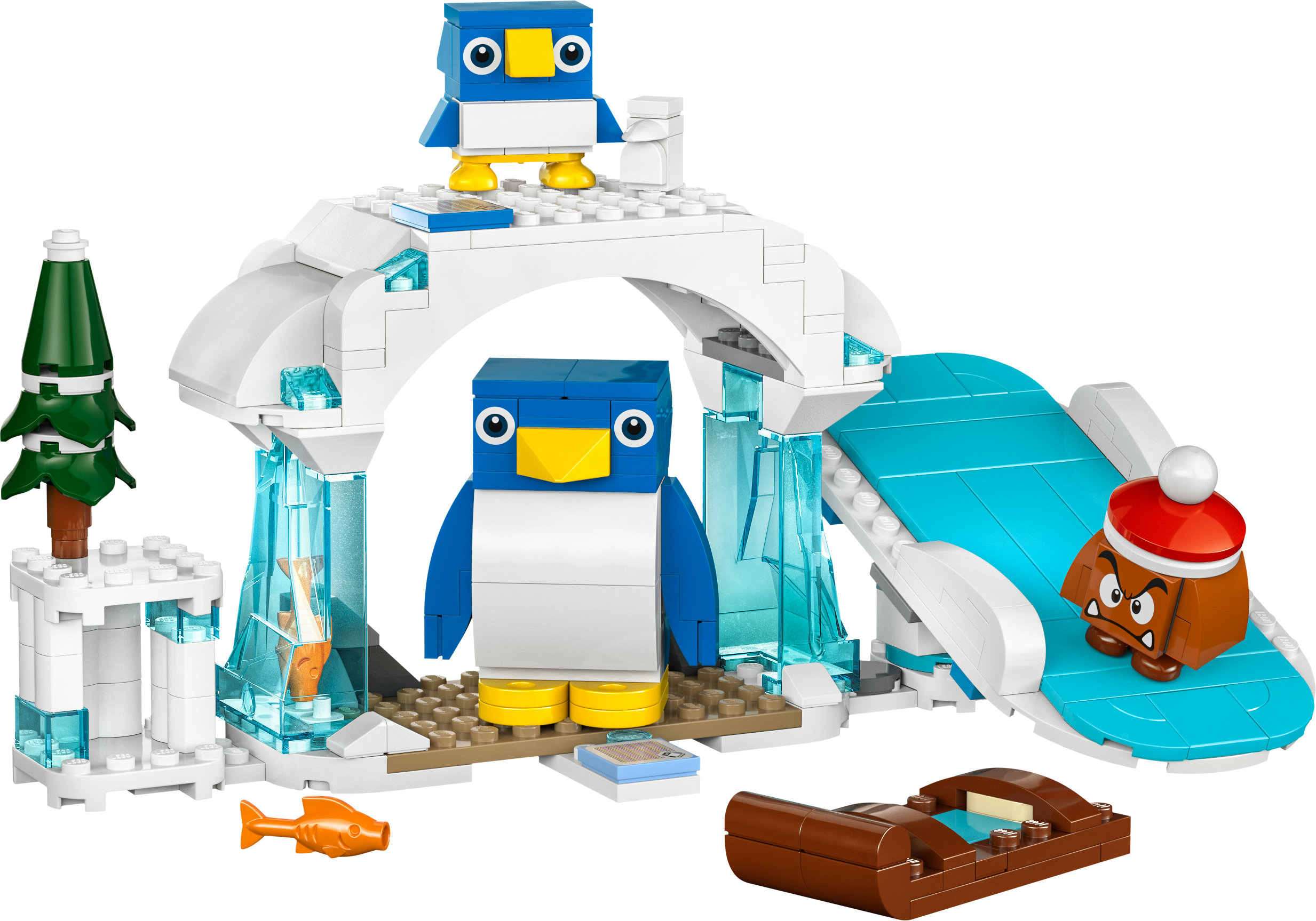 Escena Lego: Pingüinos en una estructura de hielo con tobogán, un Goomba y un pequeño árbol.