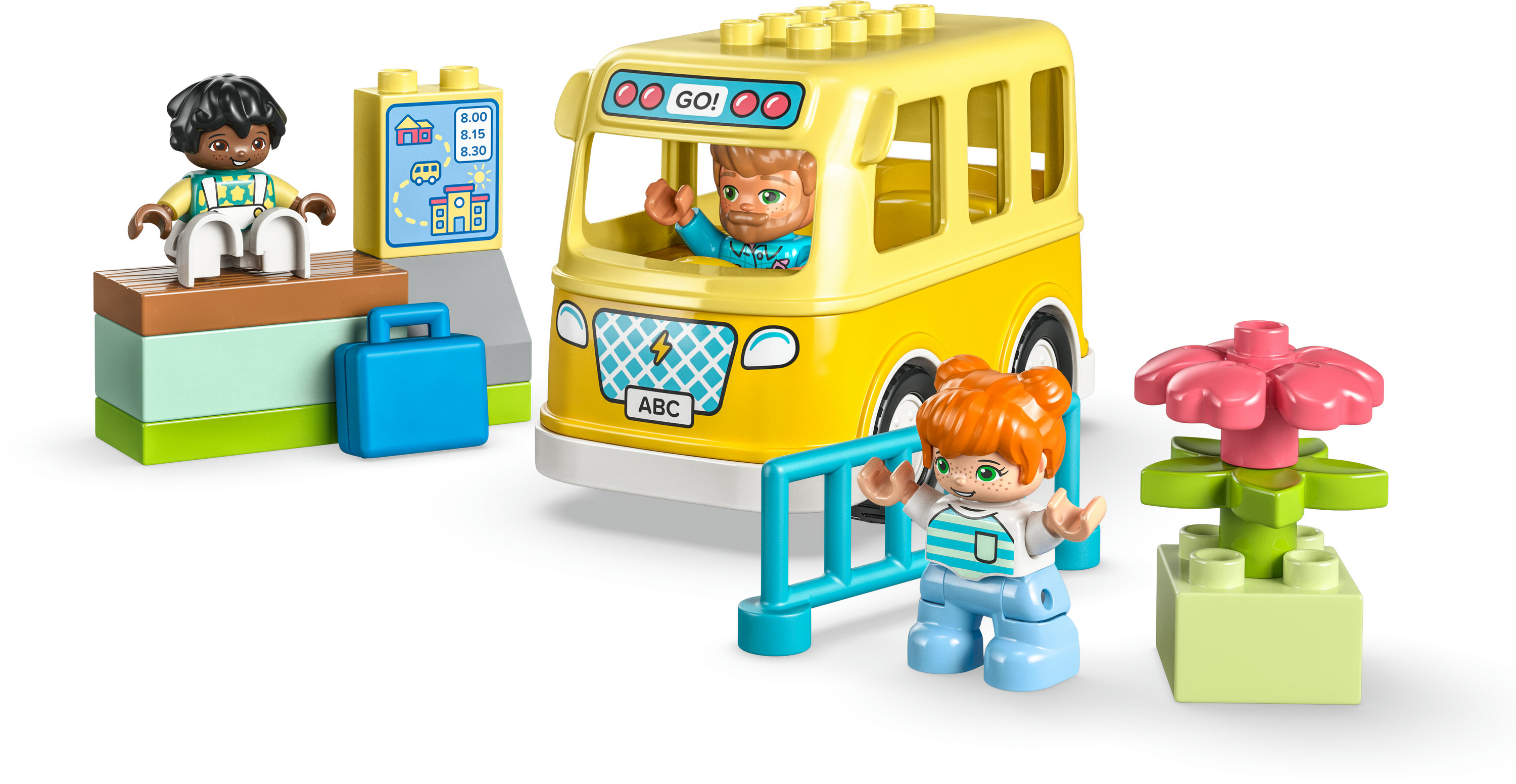 Sarı bir otobüs, figürler ve bir çiçek ile bir Lego Duplo seti.