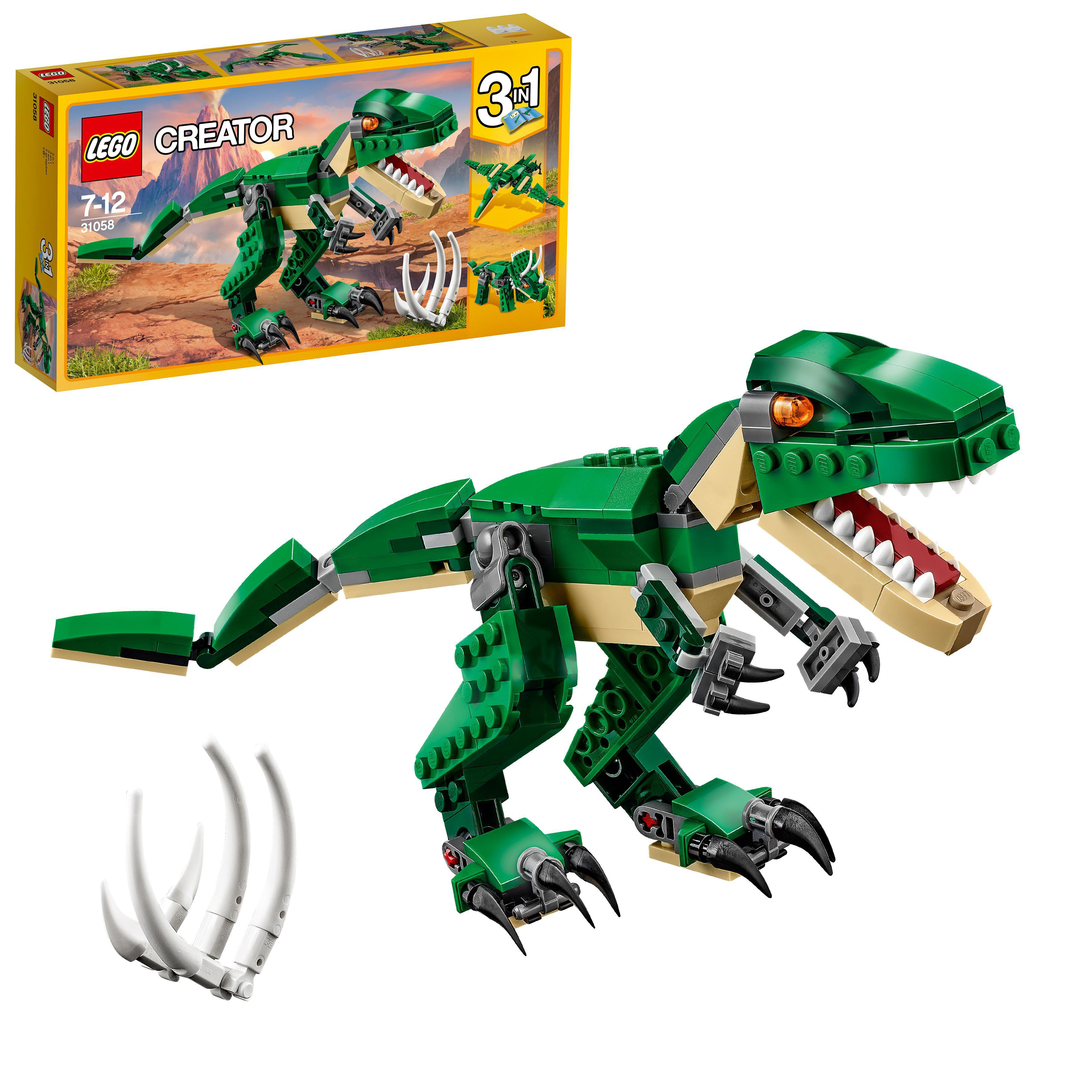 Lego Creator Dinosaurier Modell. Grüner Dinosaurier mit weißen Zähnen. Ein Set von Teilen ist ebenfalls sichtbar.