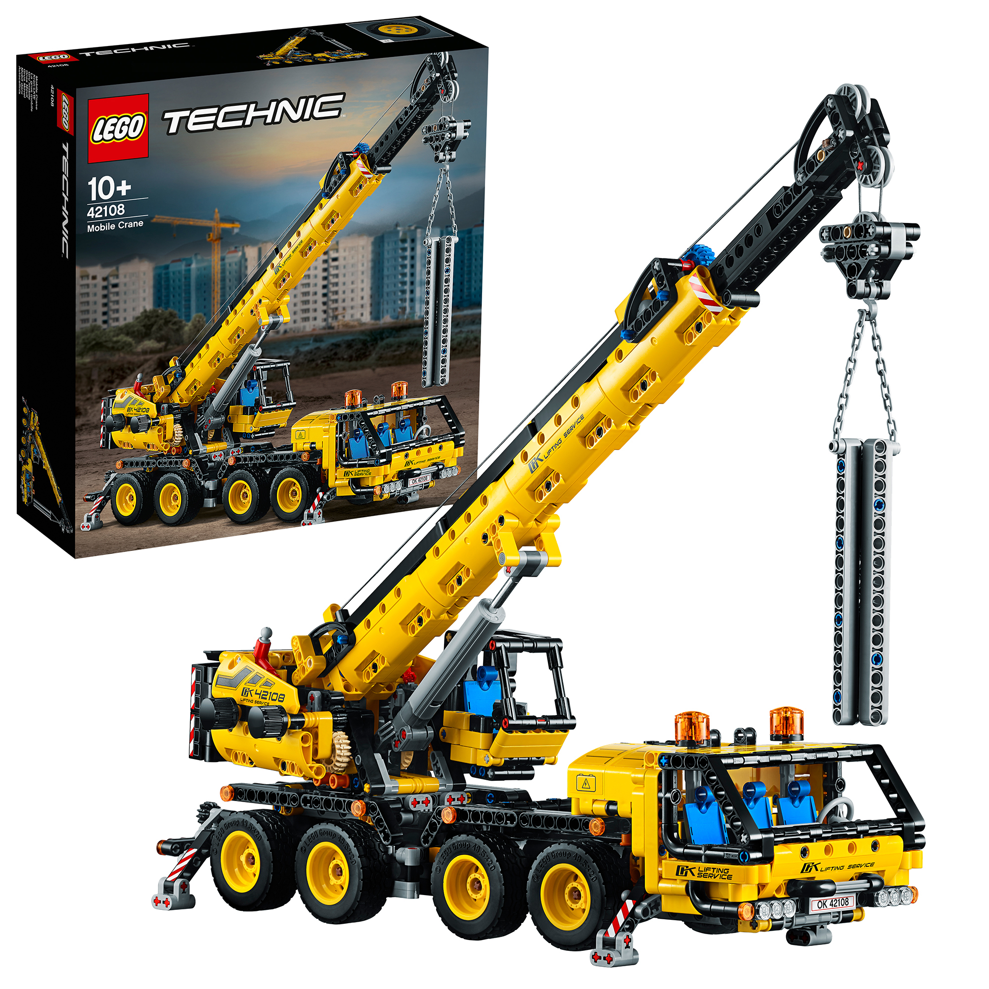 LEGO Technic Mobile Crane. Yellow crane with a black boom. Box art in the background with a construction scene.