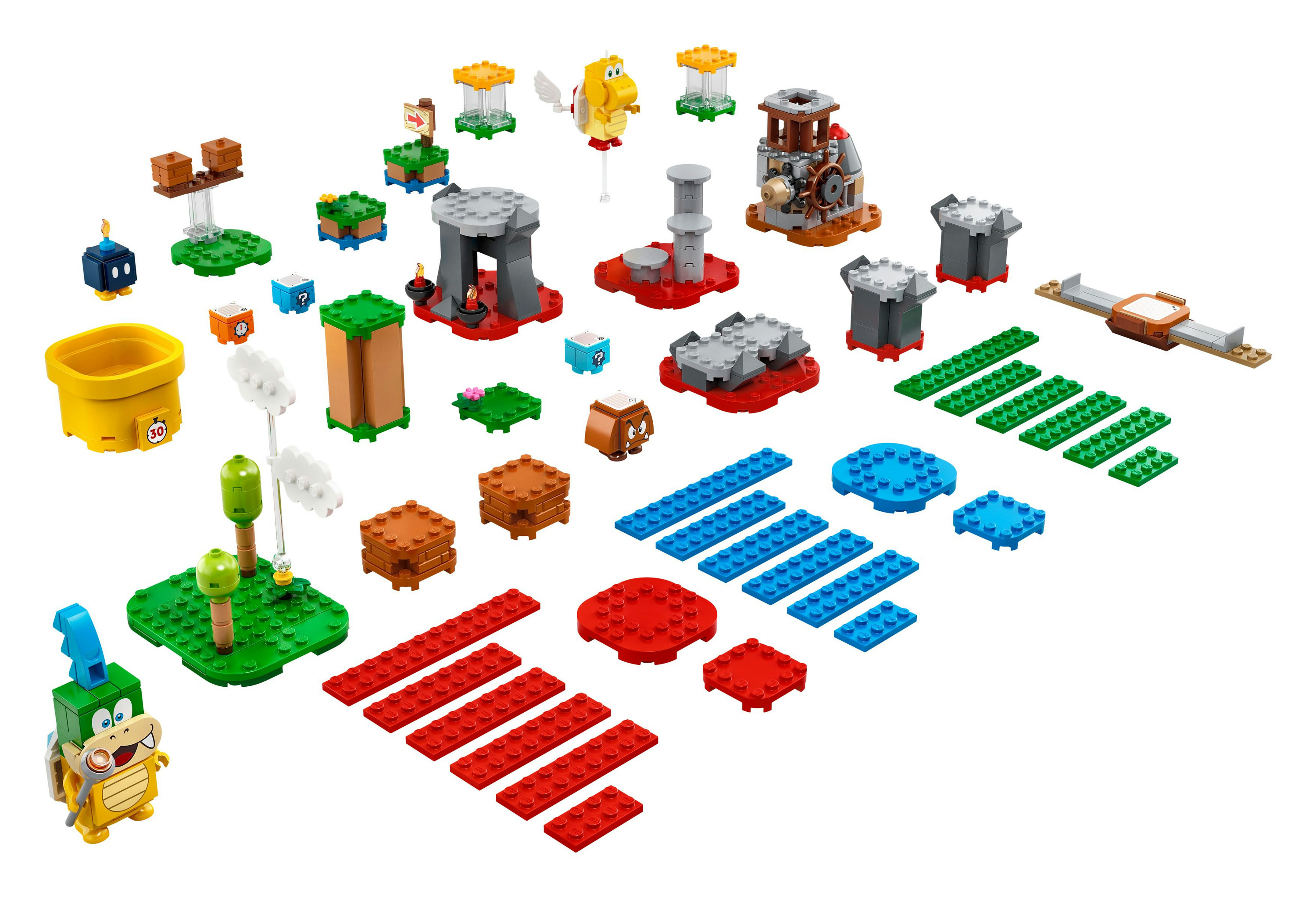 Un set LEGO Super Mario con varios bloques de construcción y personajes en una superficie blanca.
