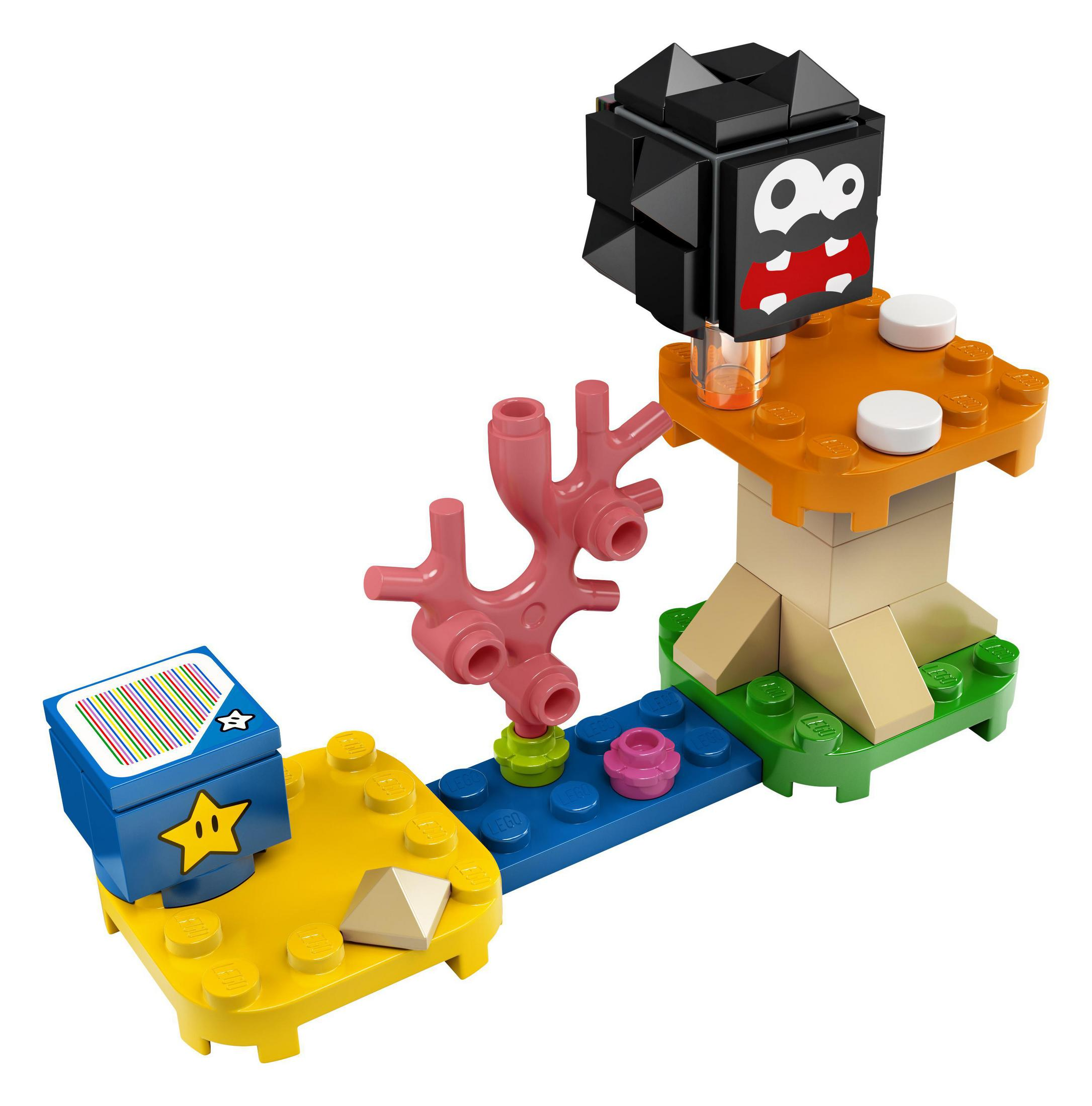 Lego Super Mario Set: Bowser Jr. und eine blockartige Struktur mit einem Pilz. Helle Farben und verspieltes Design.