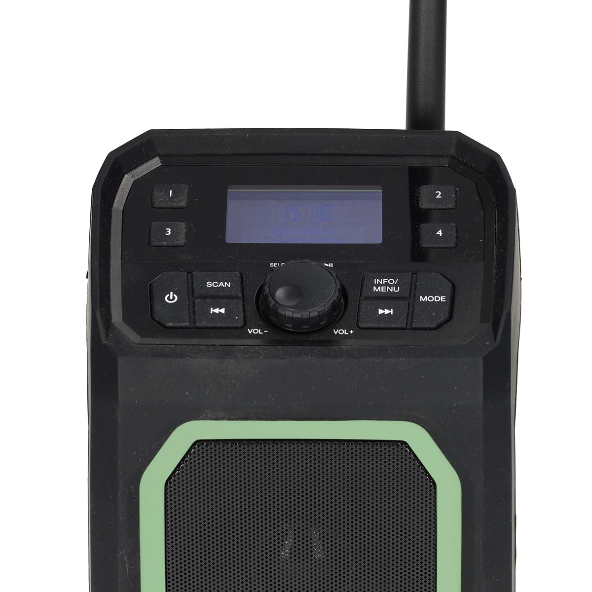 Radio negro y verde con botones y una pantalla. El fondo es oscuro.