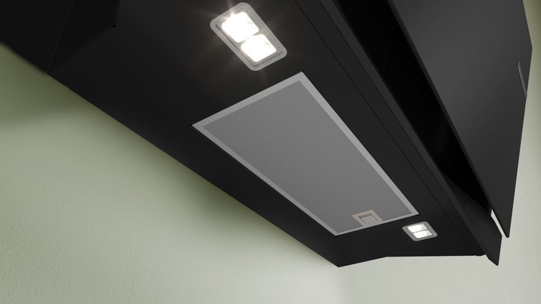Una cappa nera con due luci. Lo sfondo è un muro verde chiaro.