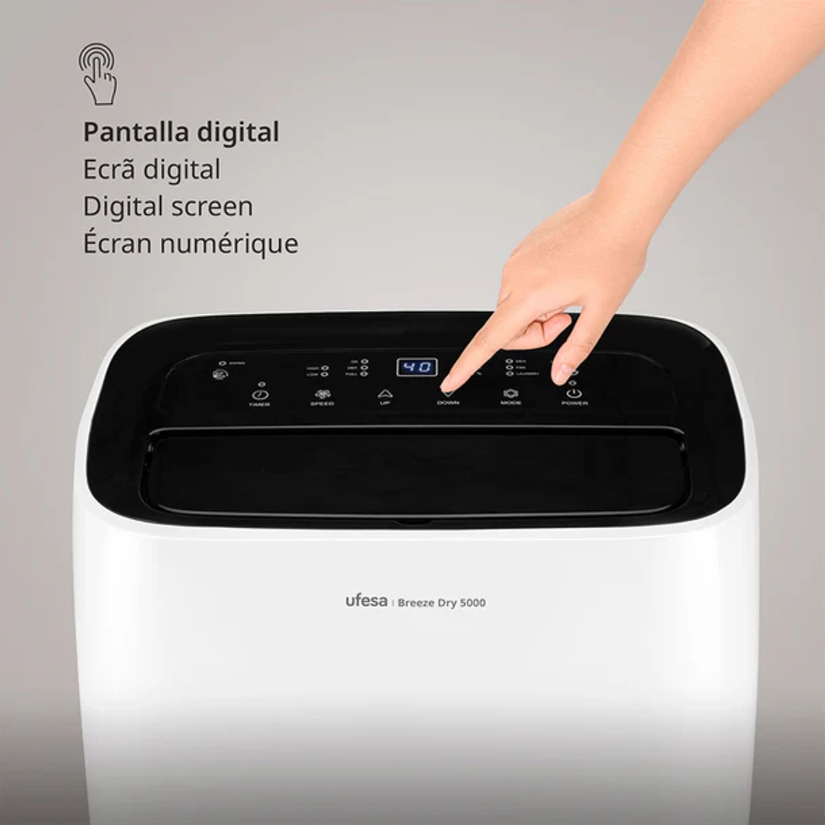 Dłoń dotyka czarno-białej cyfrowej suszarki powietrza. Ekran wyświetla liczbę 40.