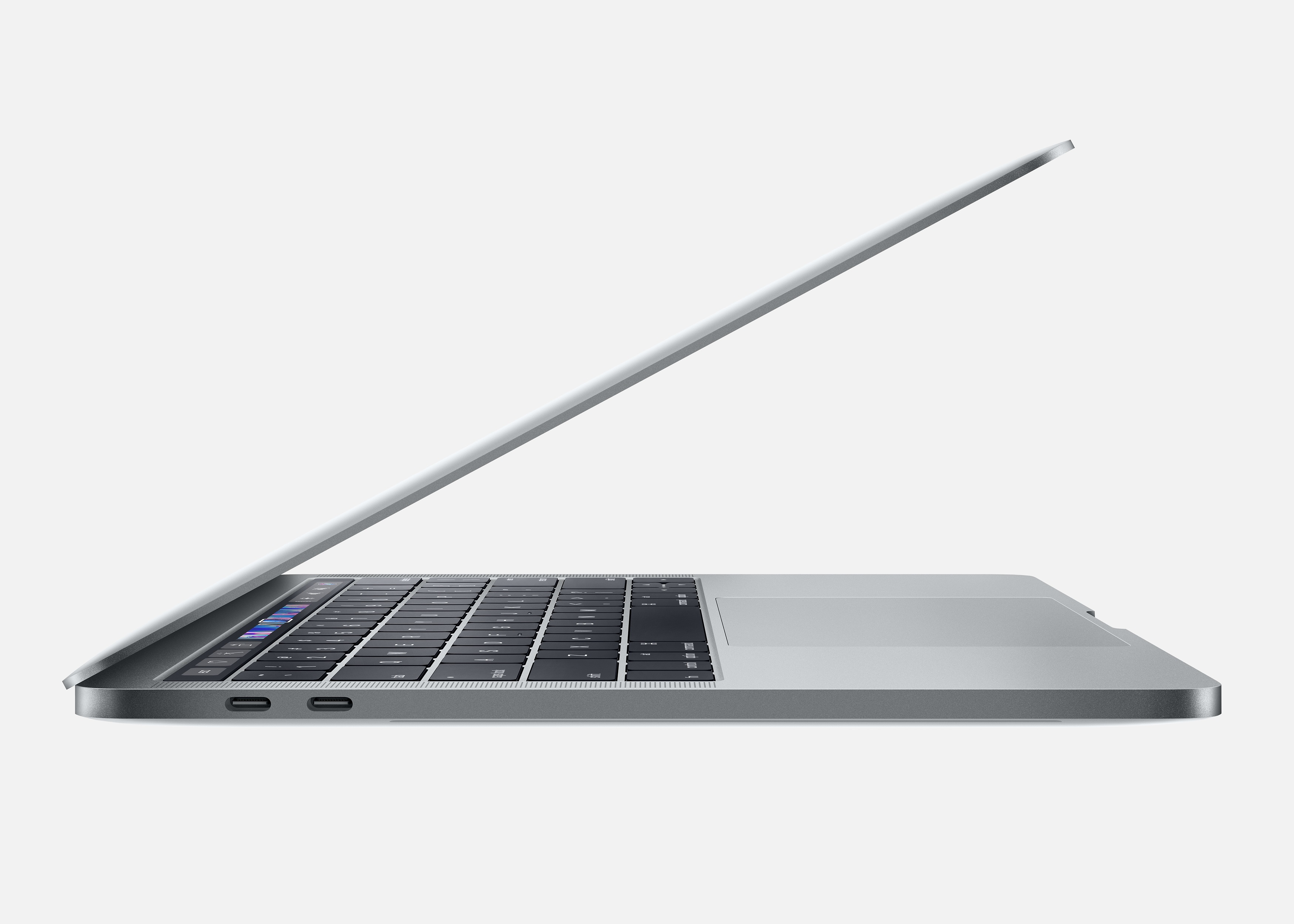 Un laptop argentato, aperto ad angolo, che mostra la tastiera e il trackpad, su sfondo bianco.
