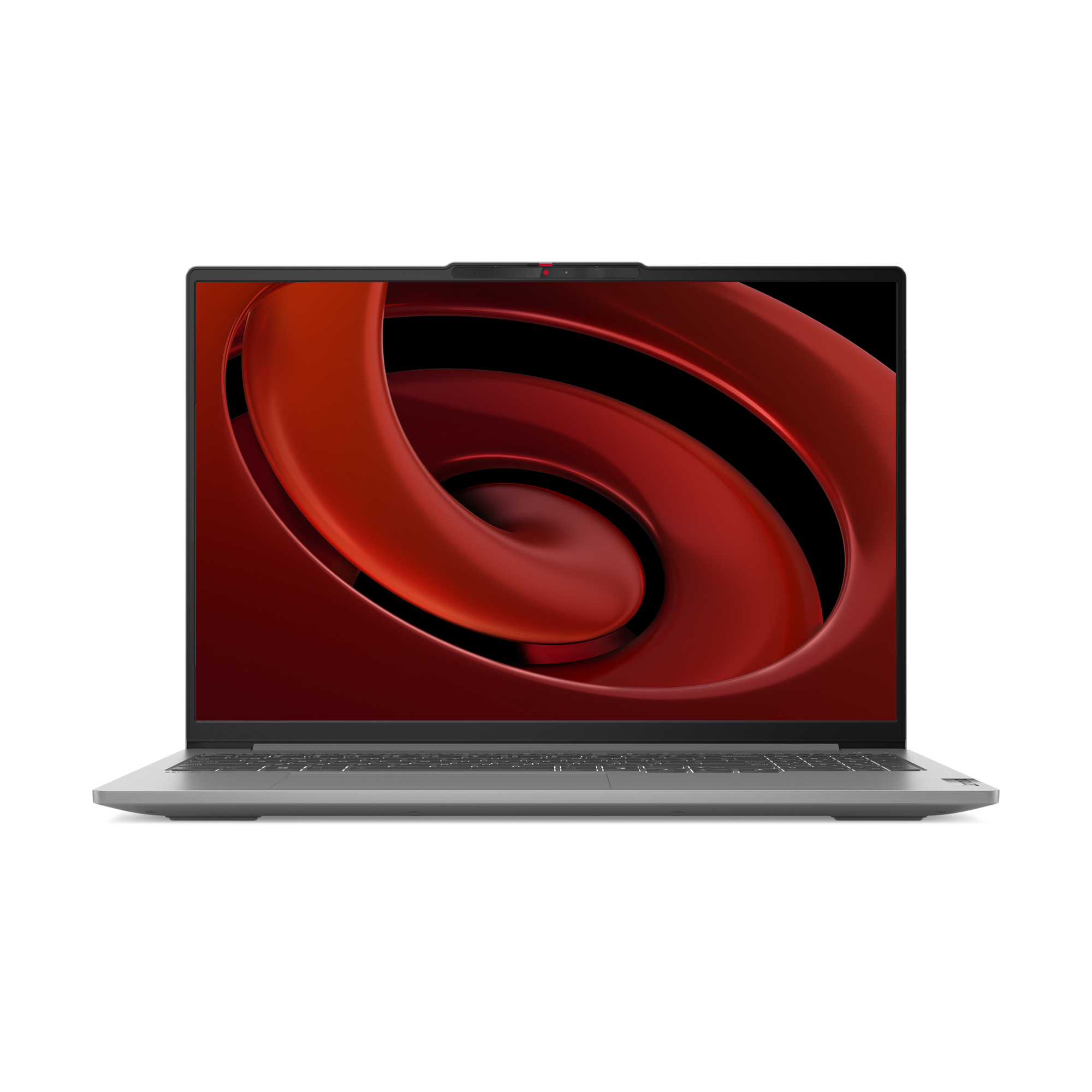 Szary laptop z czerwonym abstrakcyjnym tłem, otwarty na białej powierzchni.