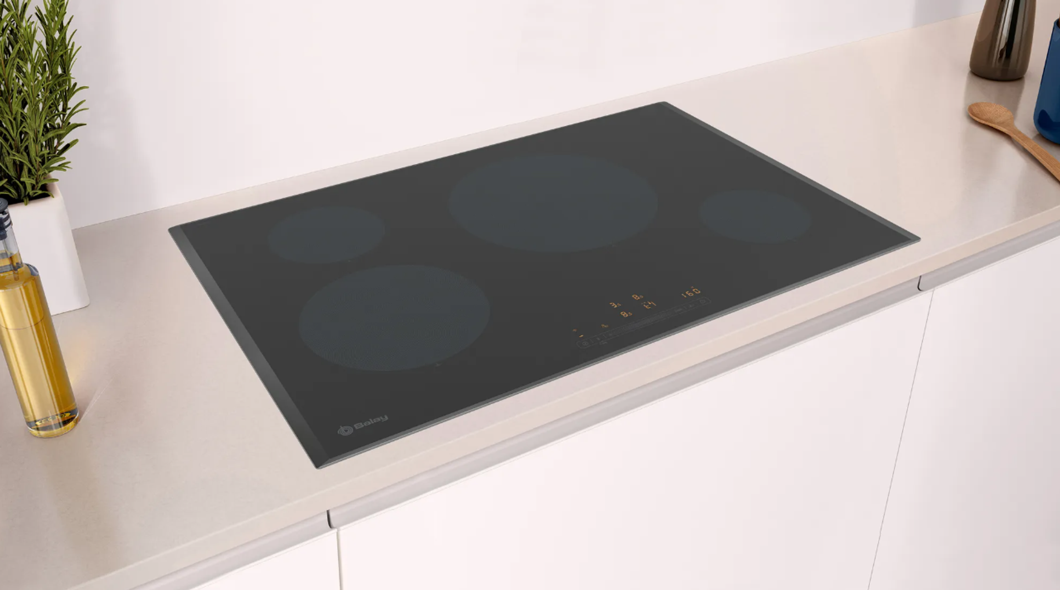 Czarna płyta indukcyjna z czterema okrągłymi strefami gotowania na białym blacie. Po lewej stronie zielona roślina.