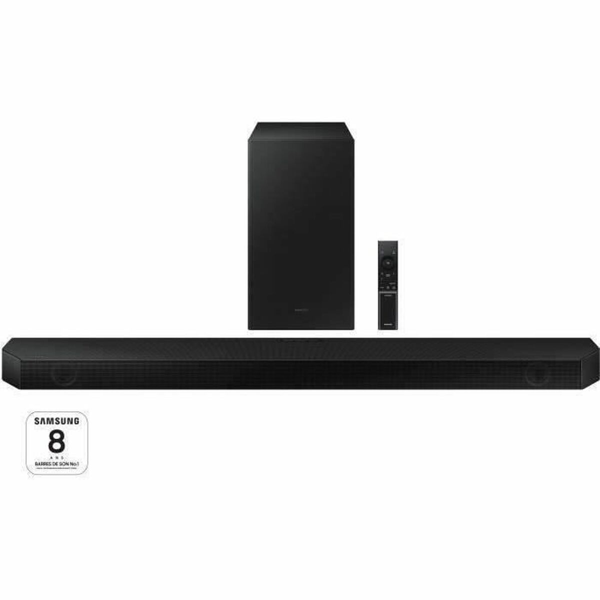 Una barra de sonido Samsung negra con subwoofer y mando a distancia. Se muestra sobre un fondo blanco.