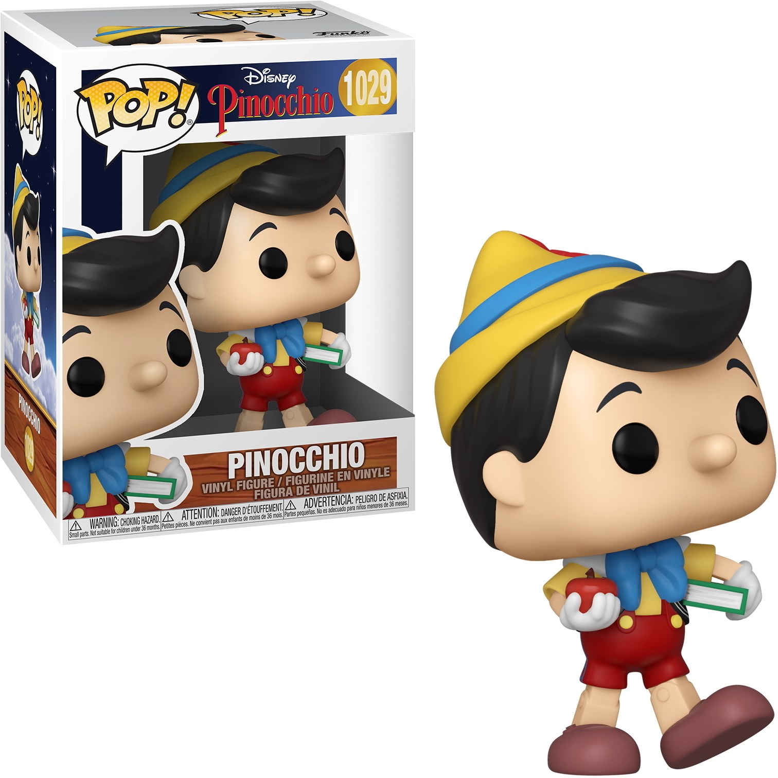 Statuina di Pinocchio con scatola, che tiene mela e libro. Scatola e statuina su sfondo bianco.