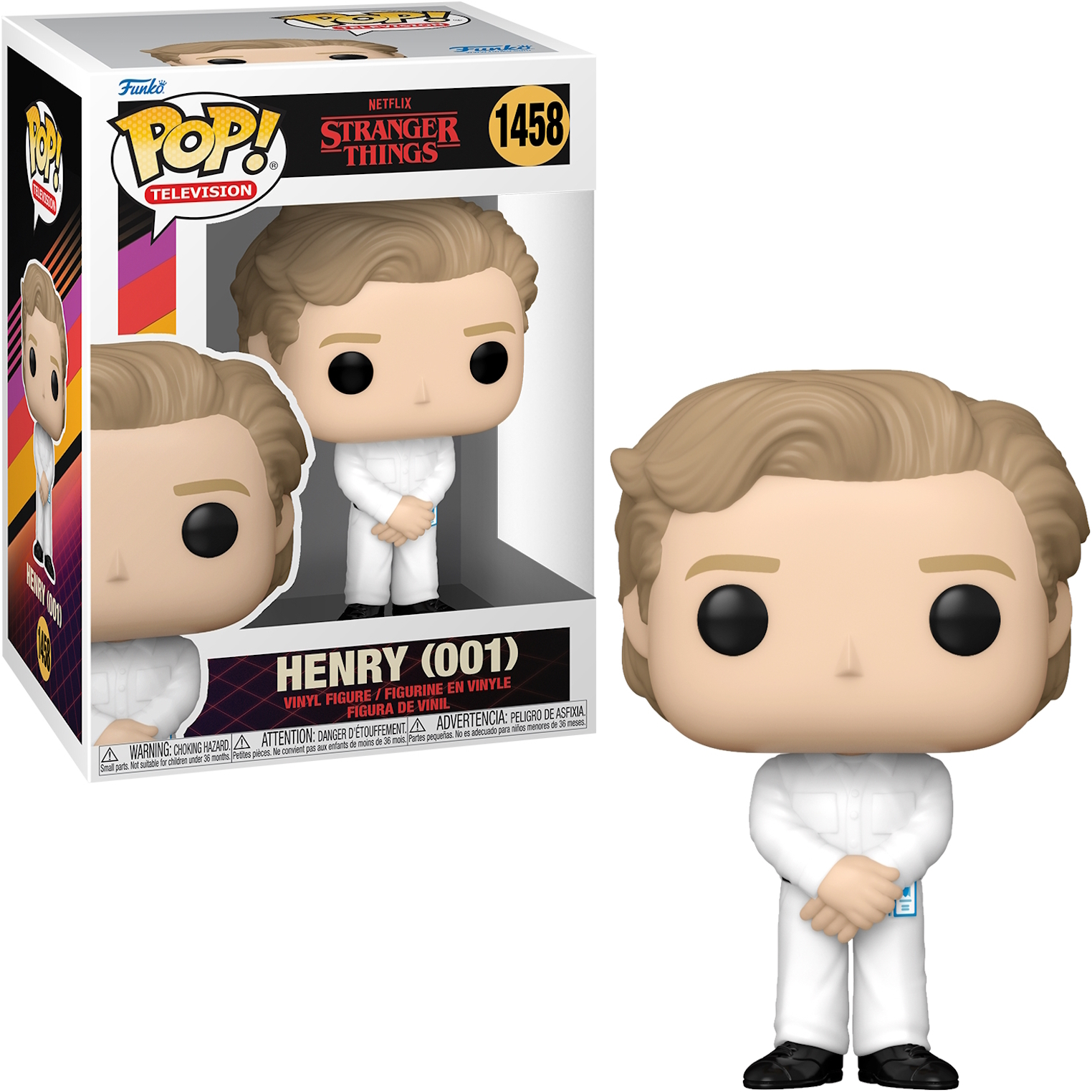 Figurka Henry'ego (001) ze Stranger Things w pudełku. Figurka ma biały kombinezon i blond włosy.