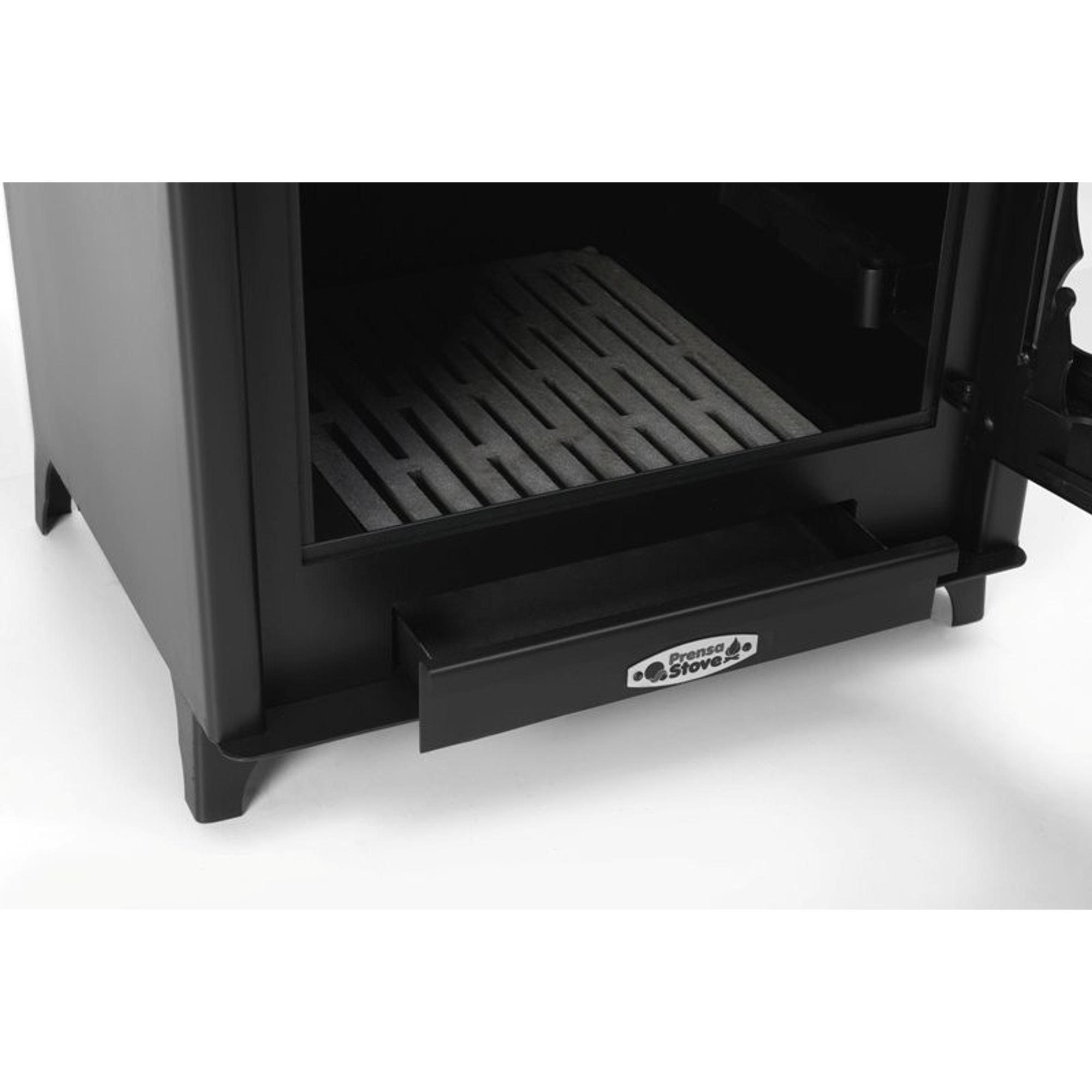 Primer plano de un horno negro con la puerta abierta. Una bandeja es visible. La marca es Prensa Stove.