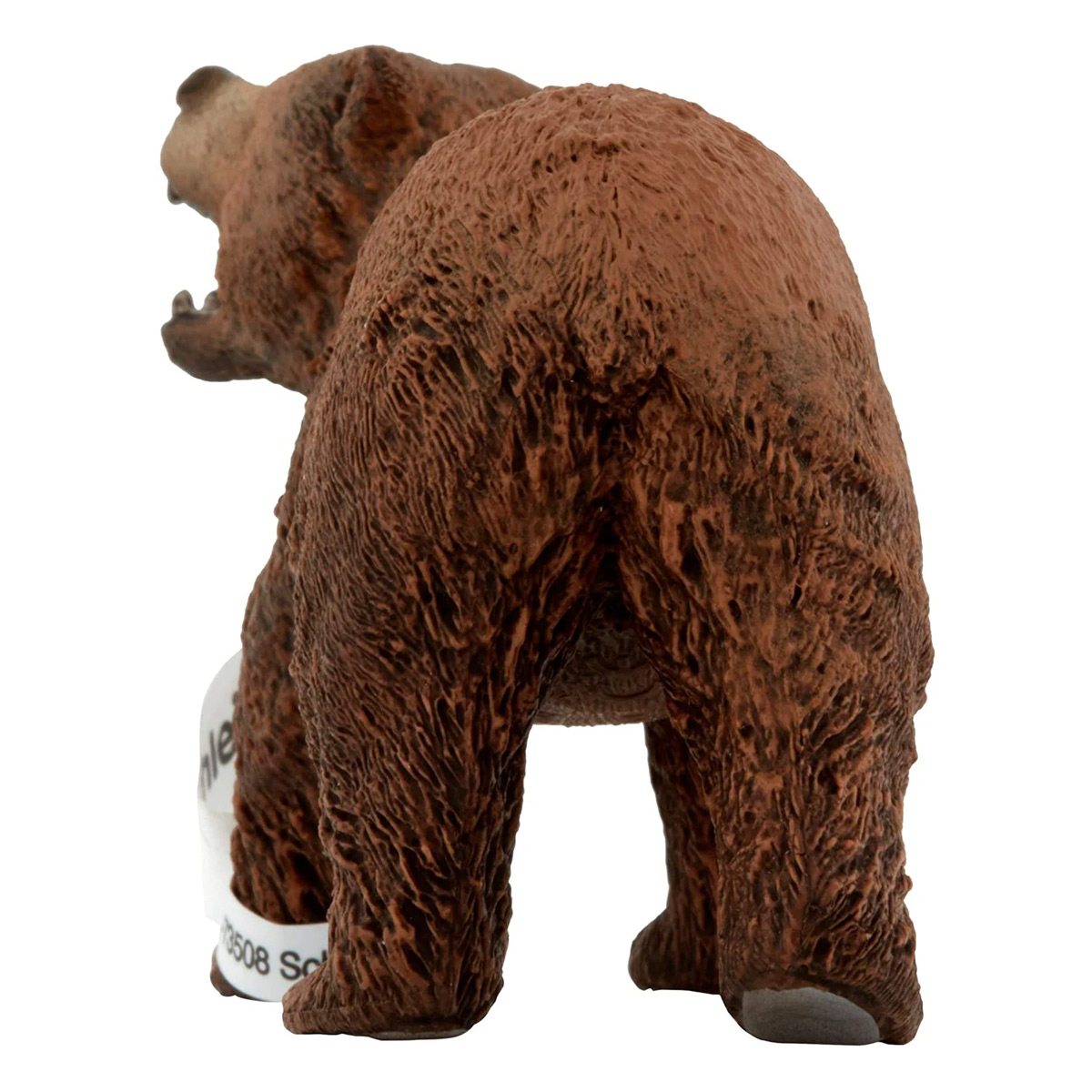 Figurka brązowego niedźwiedzia widziana od tyłu, z otwartą paszczą.