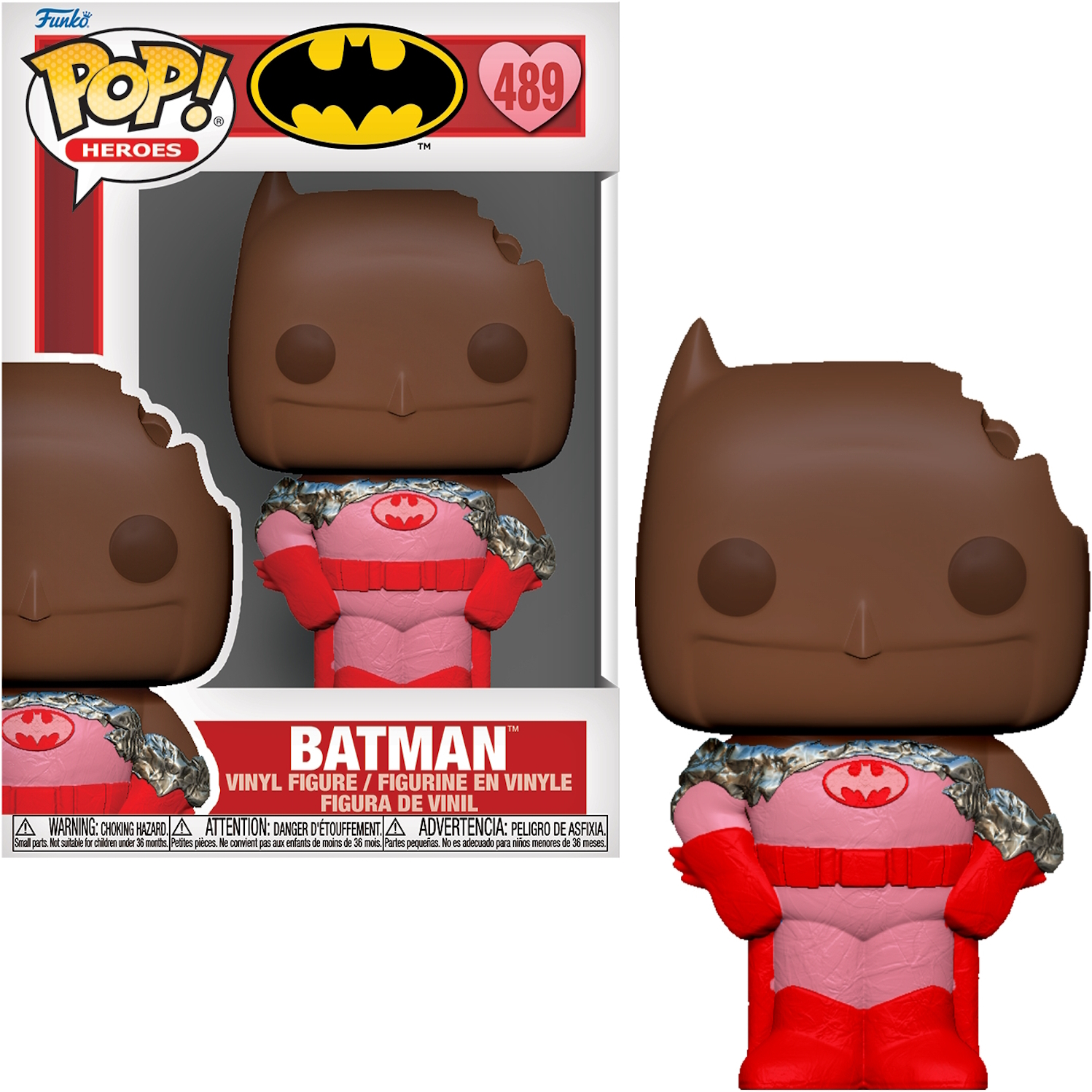 Statuetta di Batman con un morso sulla testa e un abito rosa e rosso, con un biscotto morsicato.