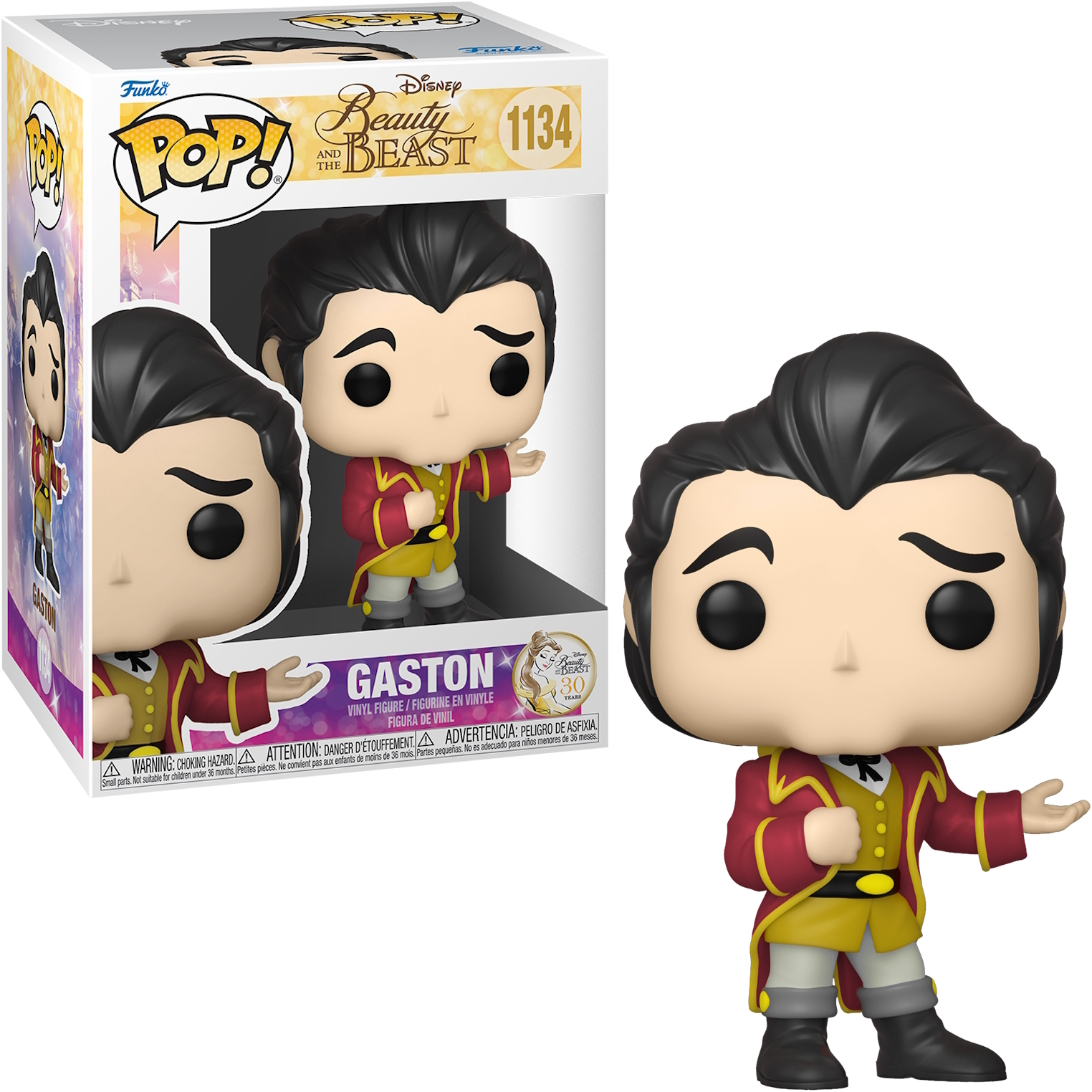Figurka Funko Pop Gastona, w pudełku i poza nim. Ma czerwony płaszcz i stoi.