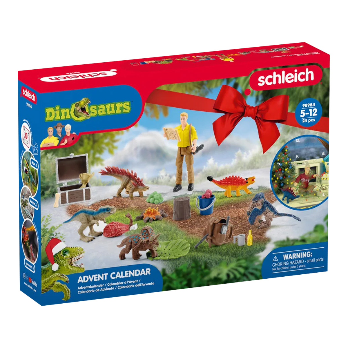 Adventskalender-Box mit Dinosaurier-Spielzeug, einer Mann-Figur und einem roten Band.