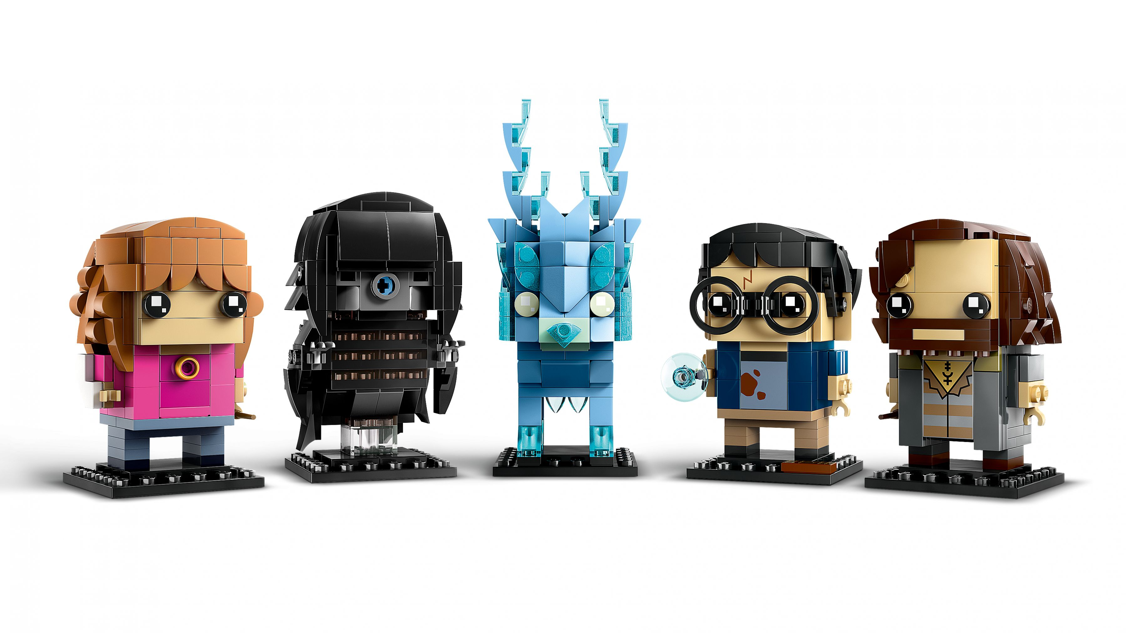 Fünf Lego-Figuren, blockartiger Stil. Sie beinhalten Hermine, einen Roboter, ein Wesen, einen Mann mit Brille.