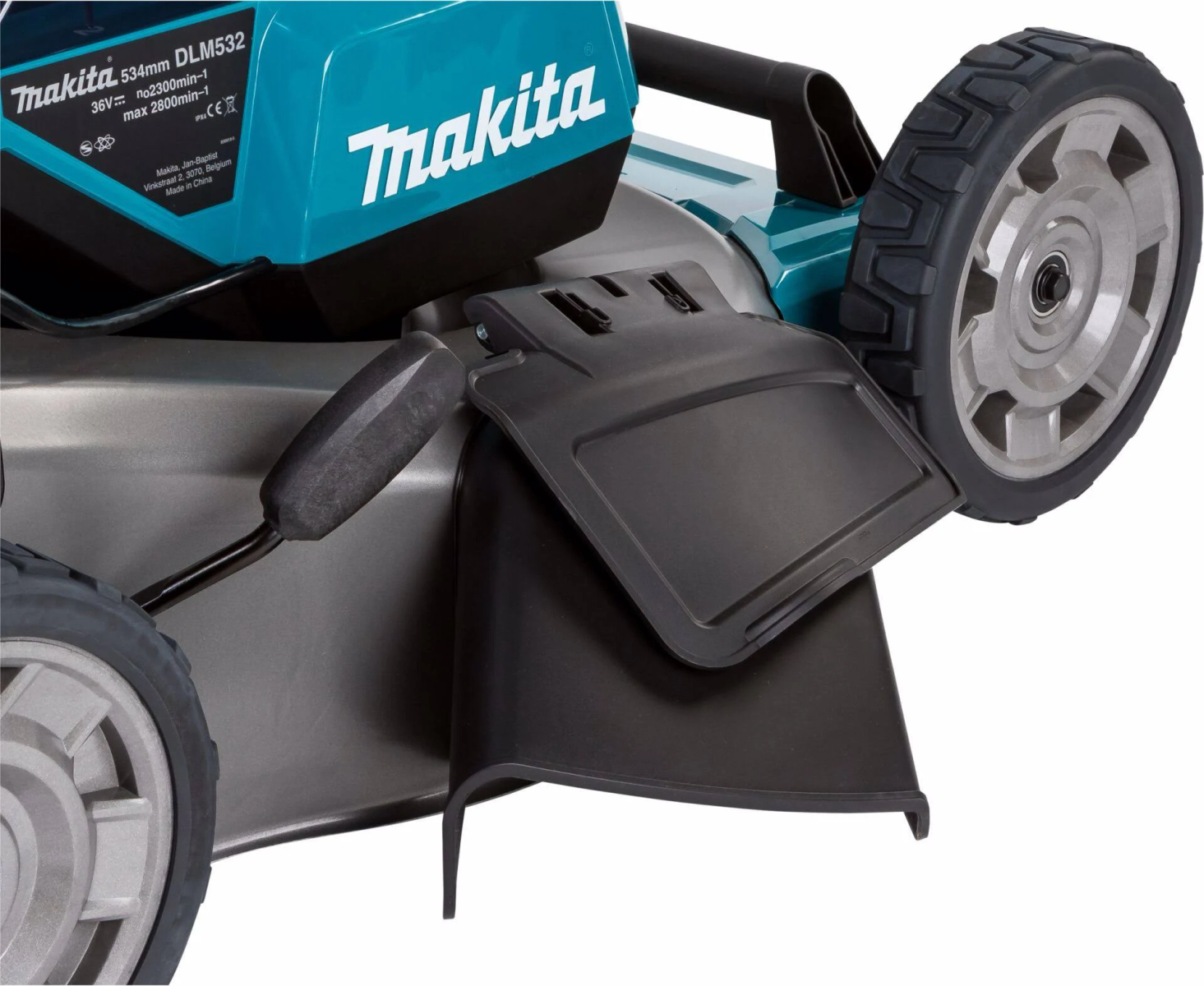 Primer plano de un cortacésped Makita. El cortacésped tiene una parte superior turquesa y dos ruedas negras.