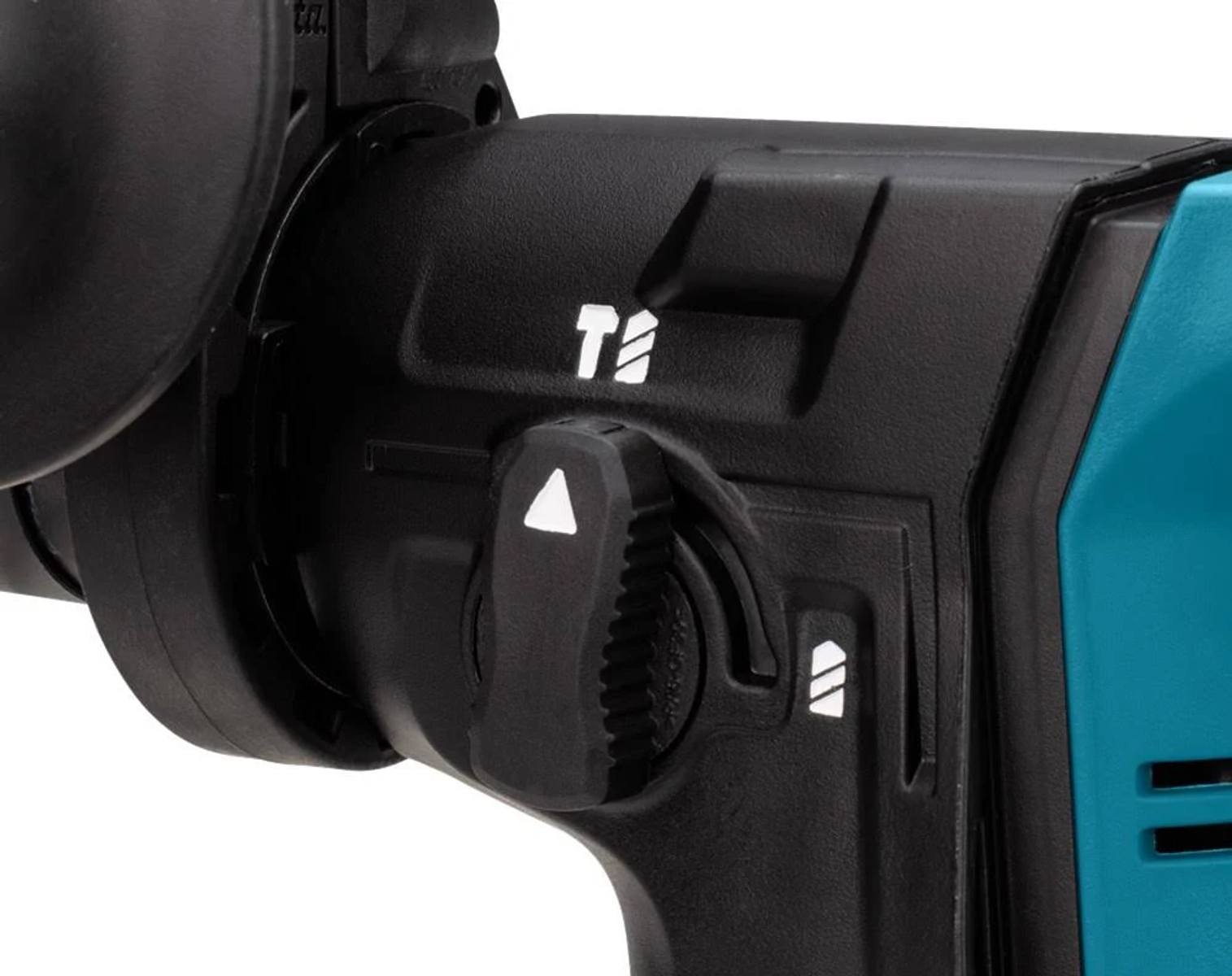 Primer plano de taladro Makita con dial y botones negros en cuerpo turquesa.