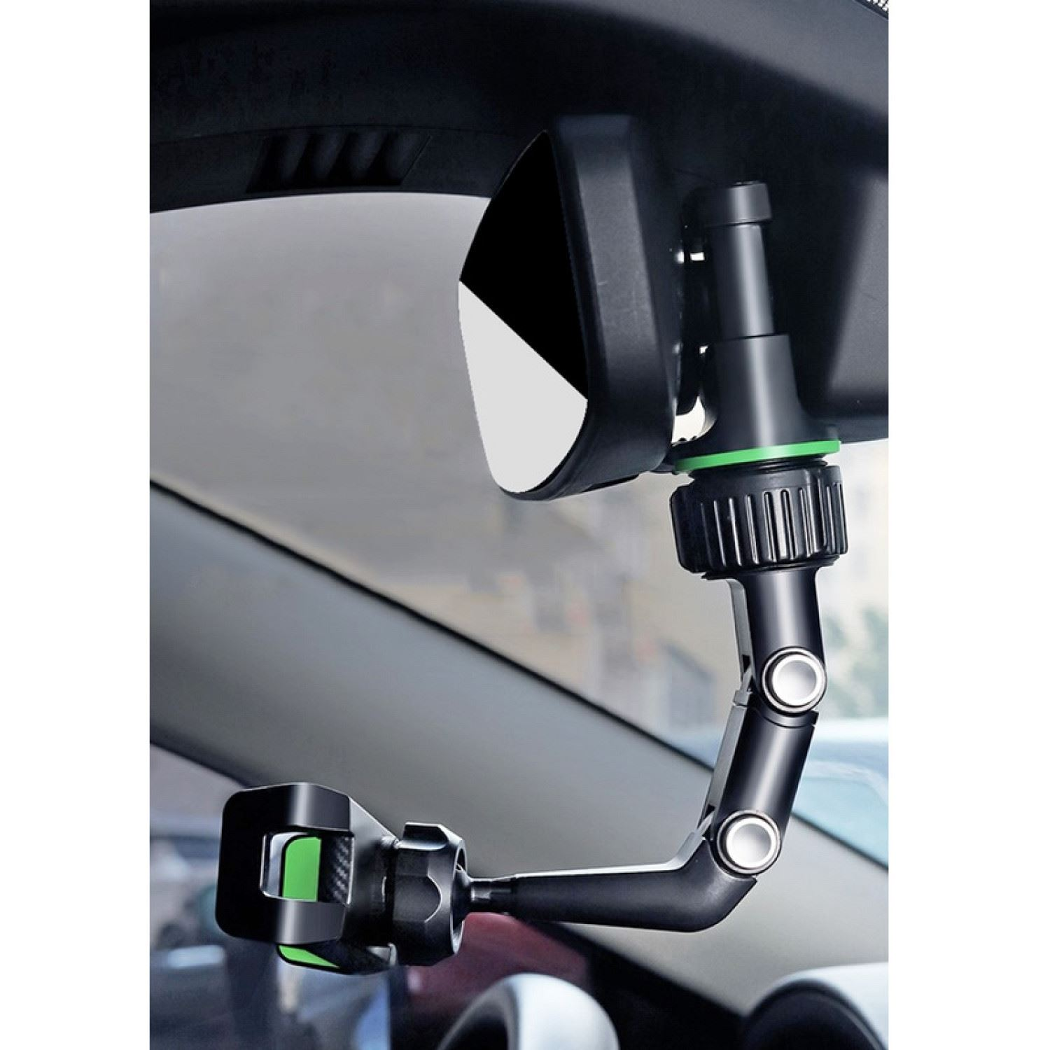Soporte para teléfono de coche montado en un espejo retrovisor. Es negro y tiene un acento verde.