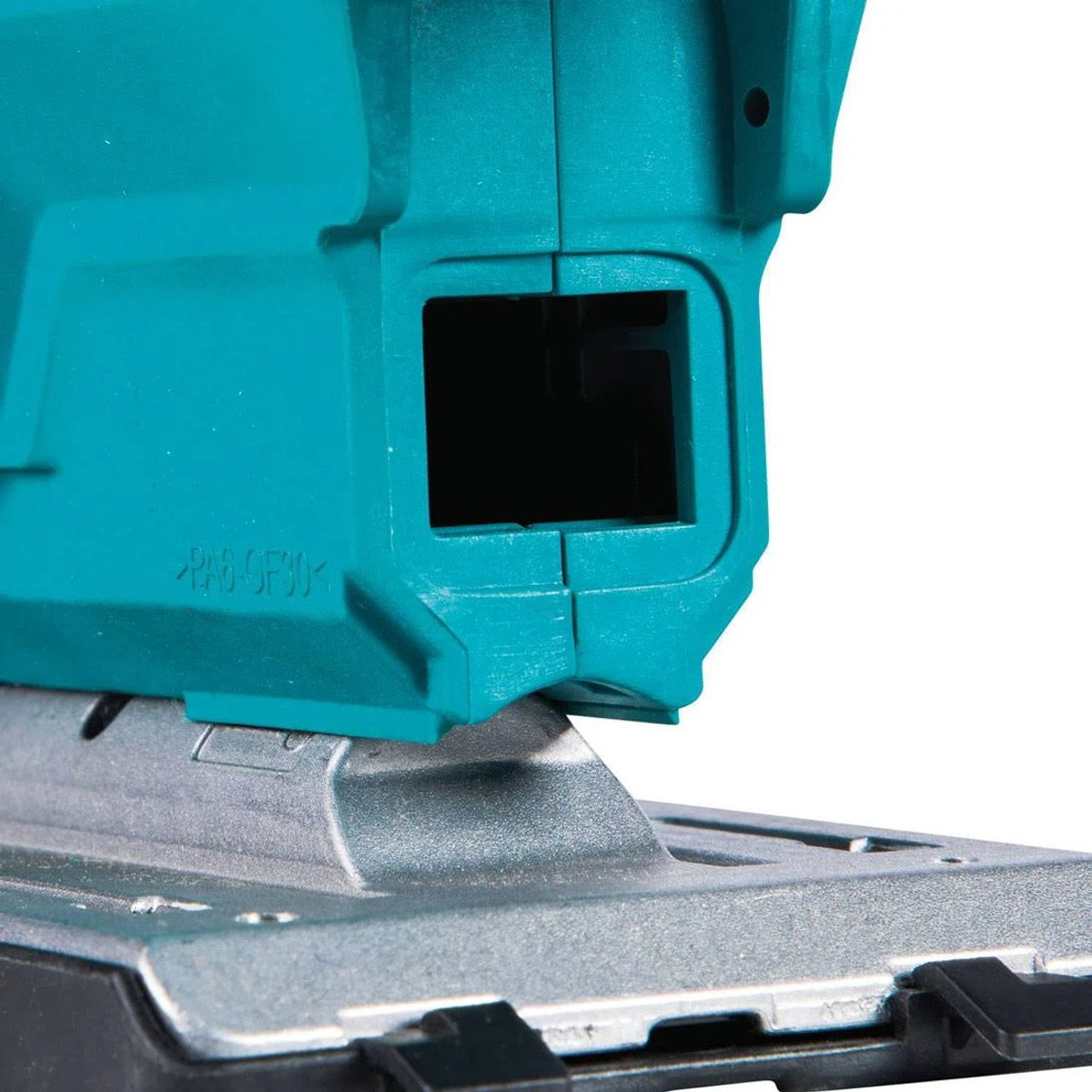 Zbliżenie na turkusowe narzędzie do wyrzynania z czarnym kwadratowym otworem. Podstawa jest srebrna.