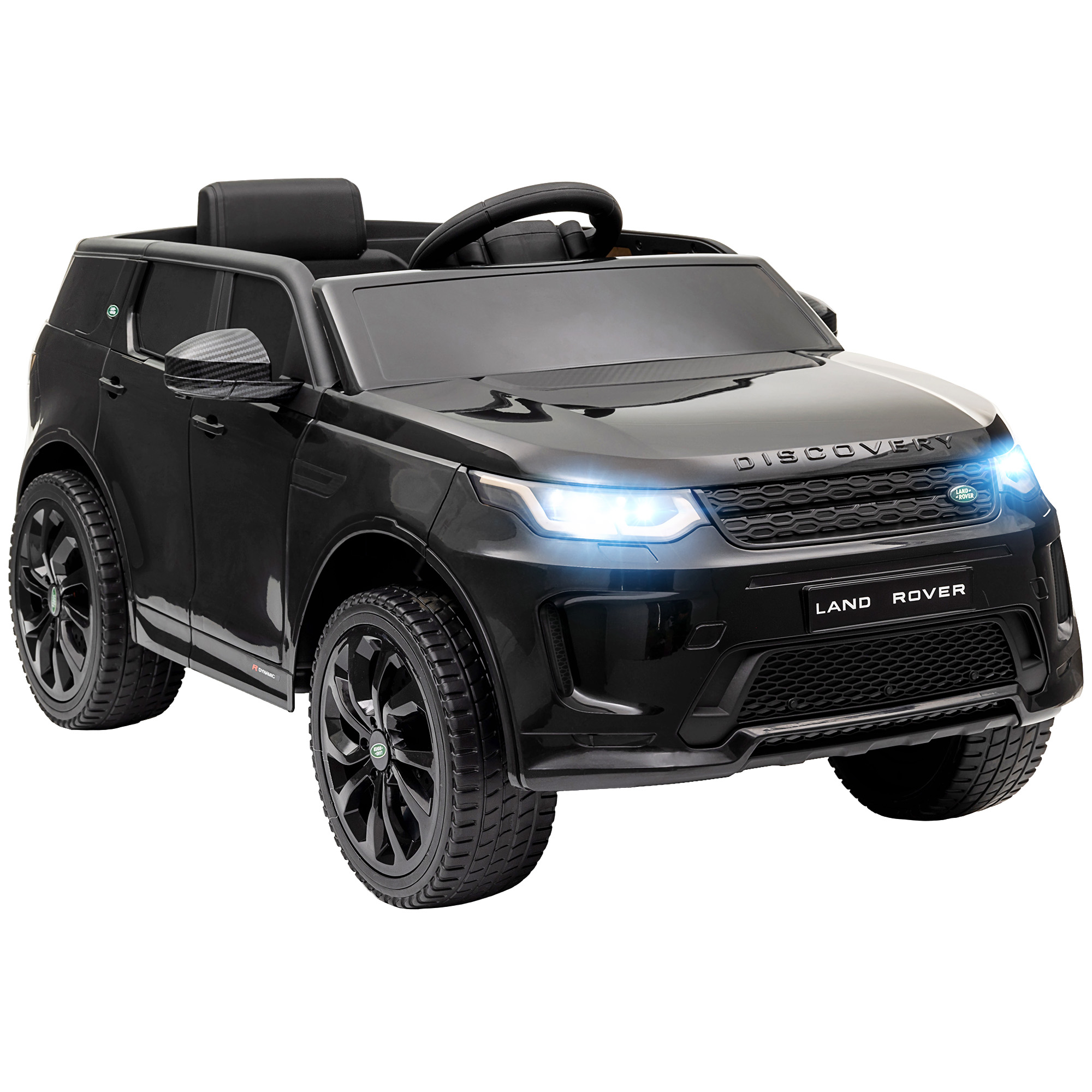 Un'auto giocattolo Land Rover Discovery nera con fari accesi, su sfondo bianco.