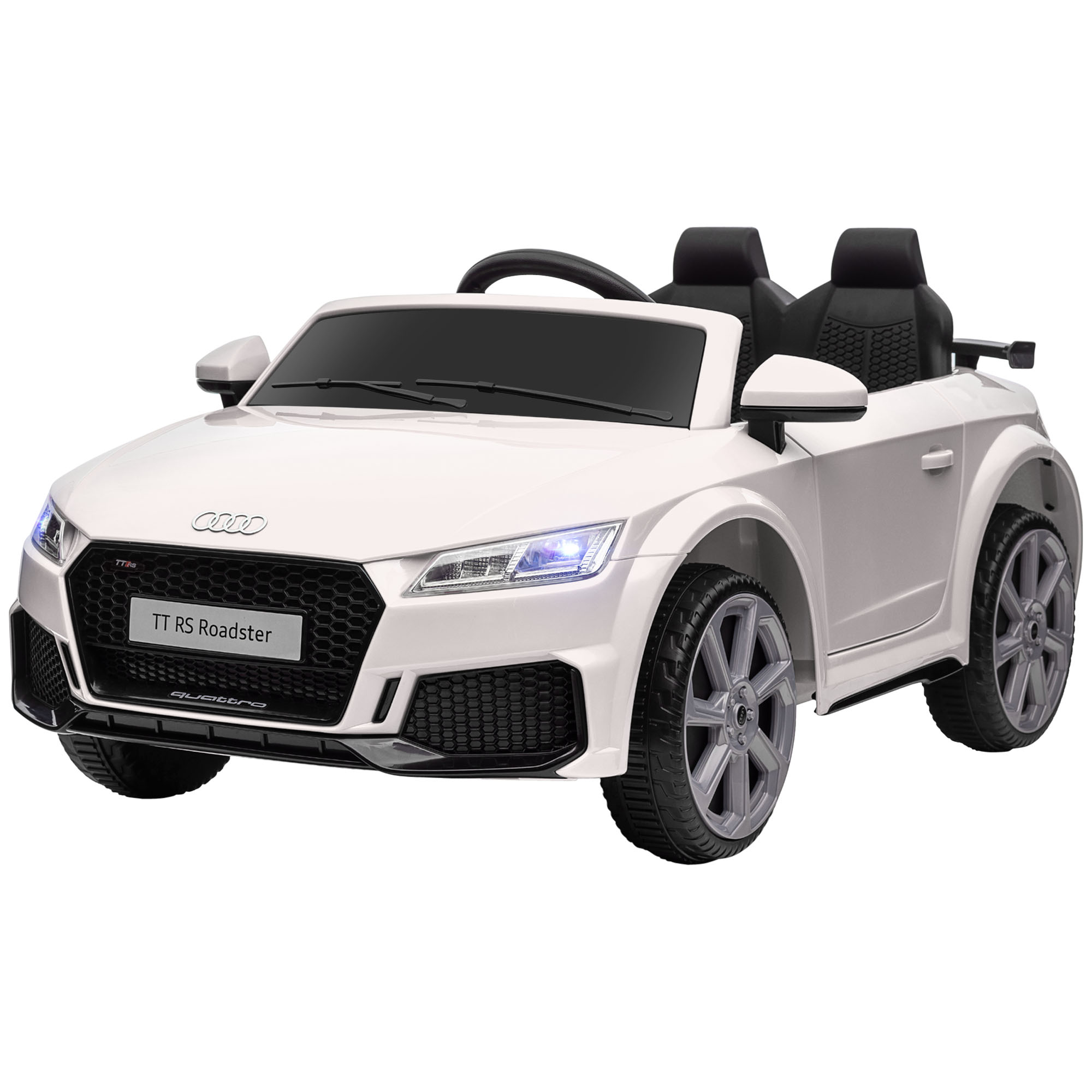 Un'auto giocattolo Audi TT RS Roadster bianca con sedili neri è mostrata su sfondo bianco.
