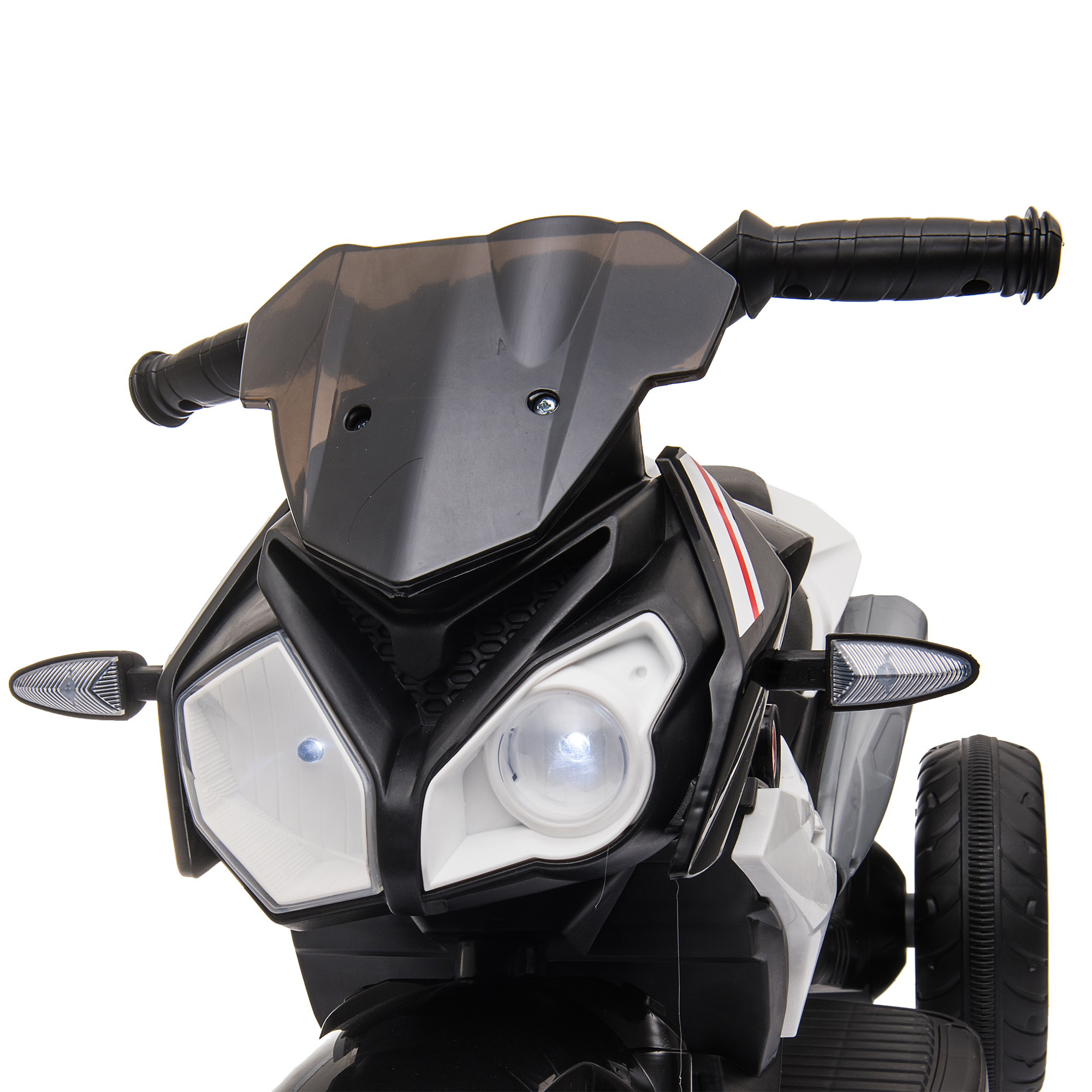 Primo piano del frontale di una moto giocattolo, bianco e nero con faro.