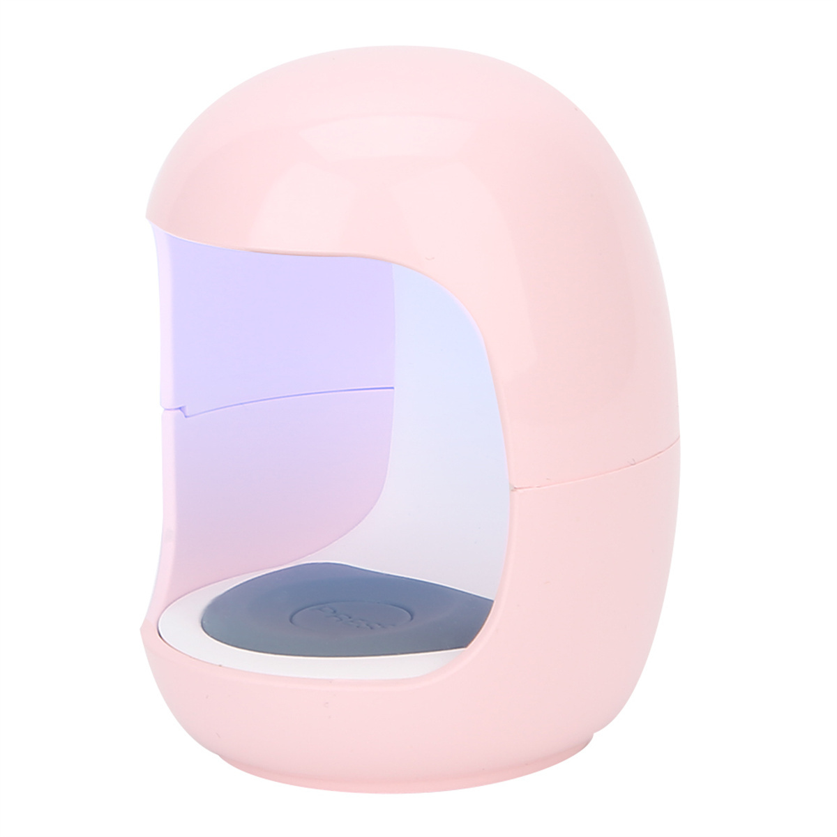 Eine rosa Nagelhärtungslampe. Die Lampe hat eine abgerundete Oberseite mit einem violetten Licht im Inneren. Die Basis hat eine dunkelgraue Oberfläche.