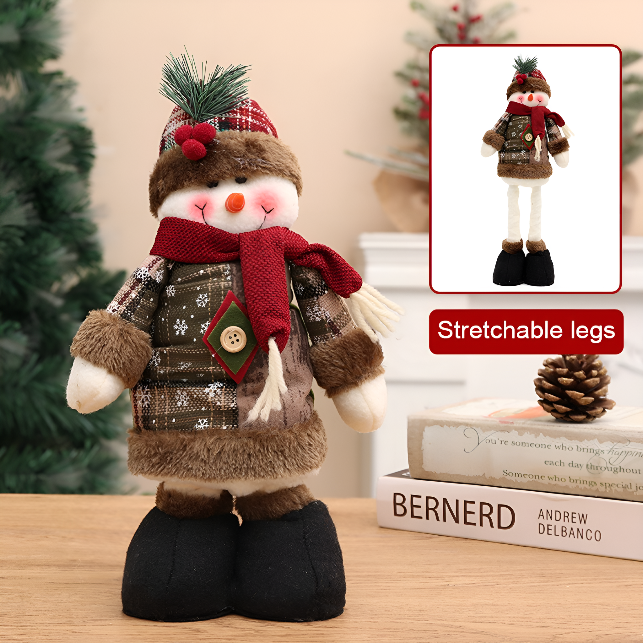 Schneemannpuppe mit dehnbaren Beinen, Schal und Hut auf einem Holztisch.