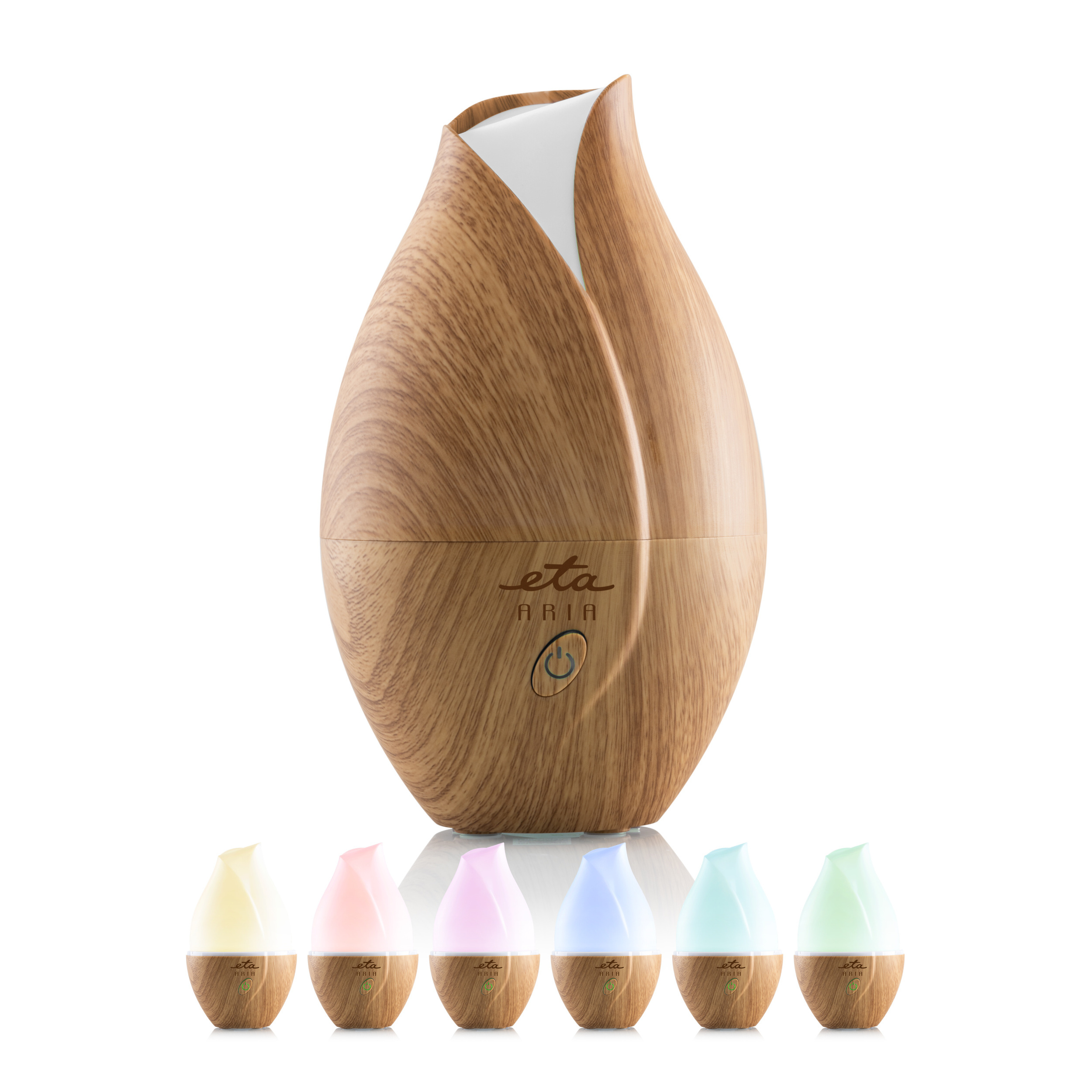 Dyfuzor w kształcie drewna z białą górą. Posiada przycisk zasilania i wyświetlacz kolorów.