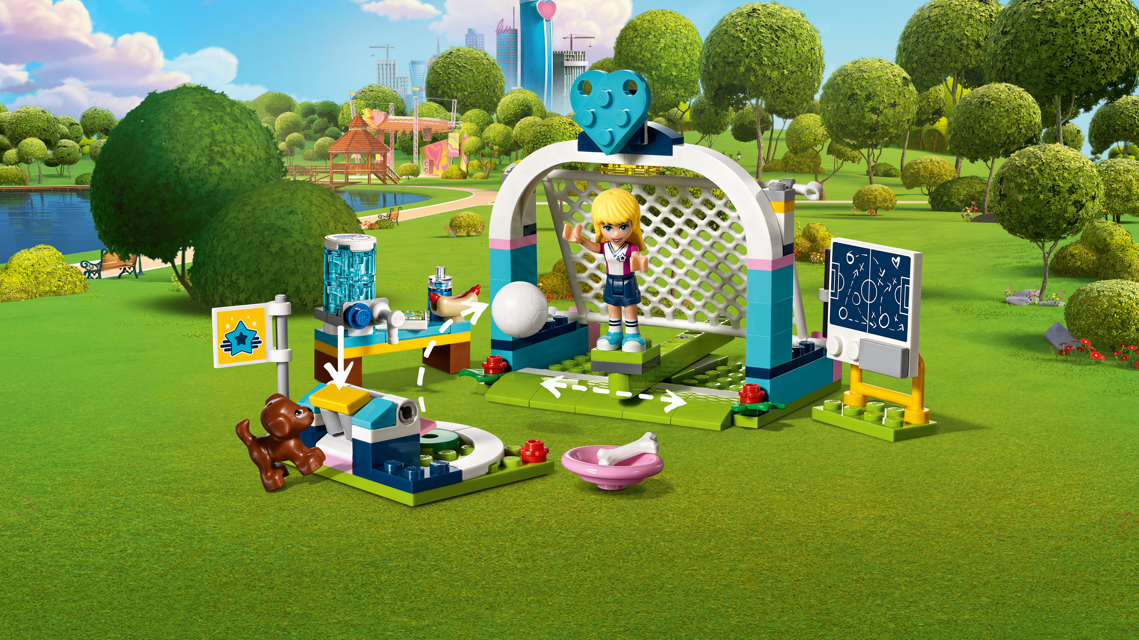 Zestaw Lego Friends z boiskiem do piłki nożnej, dziewczyną, misiem i bramką.
