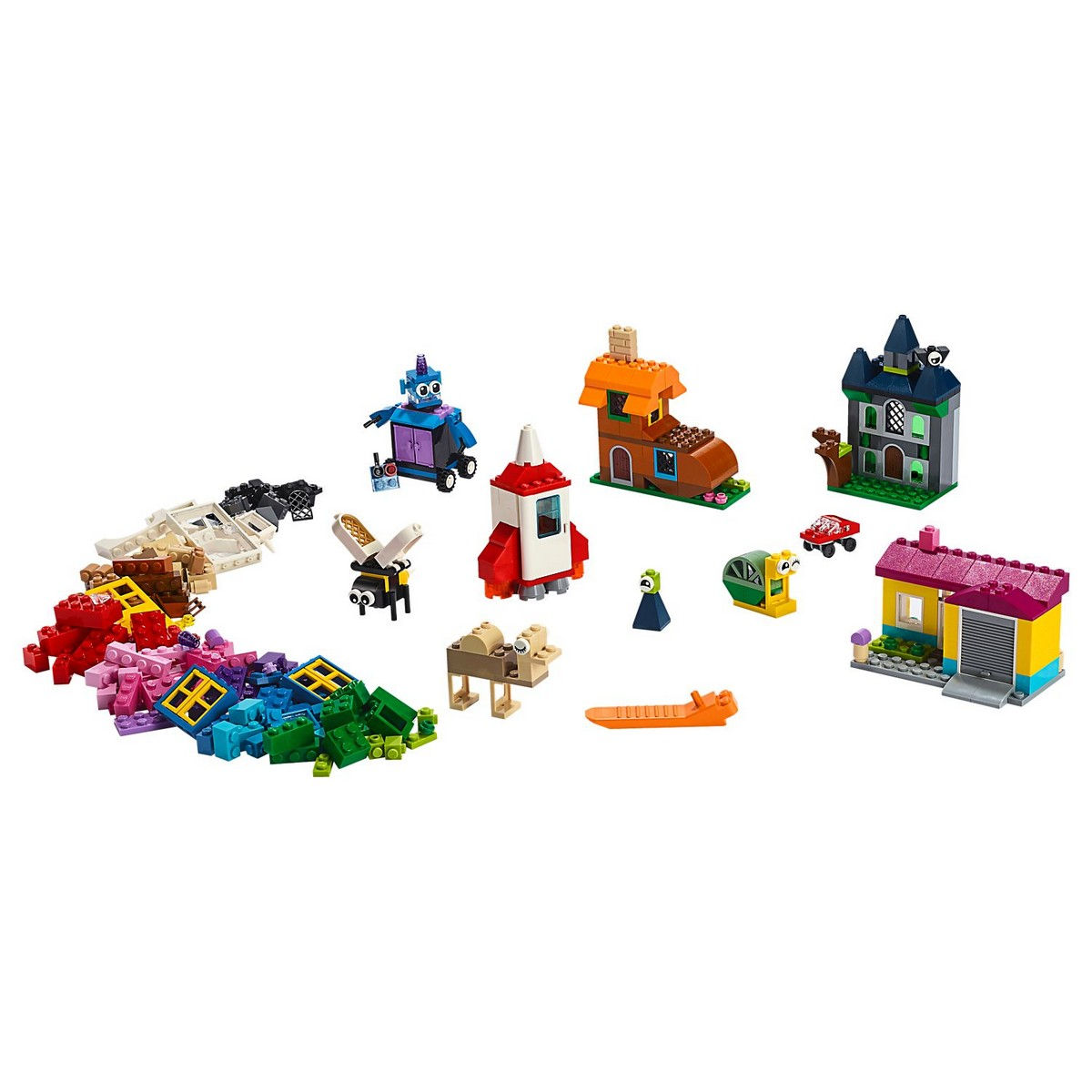 Una varietà di mattoncini Lego Classic disposti per assomigliare a piccoli edifici, veicoli e altri oggetti.
