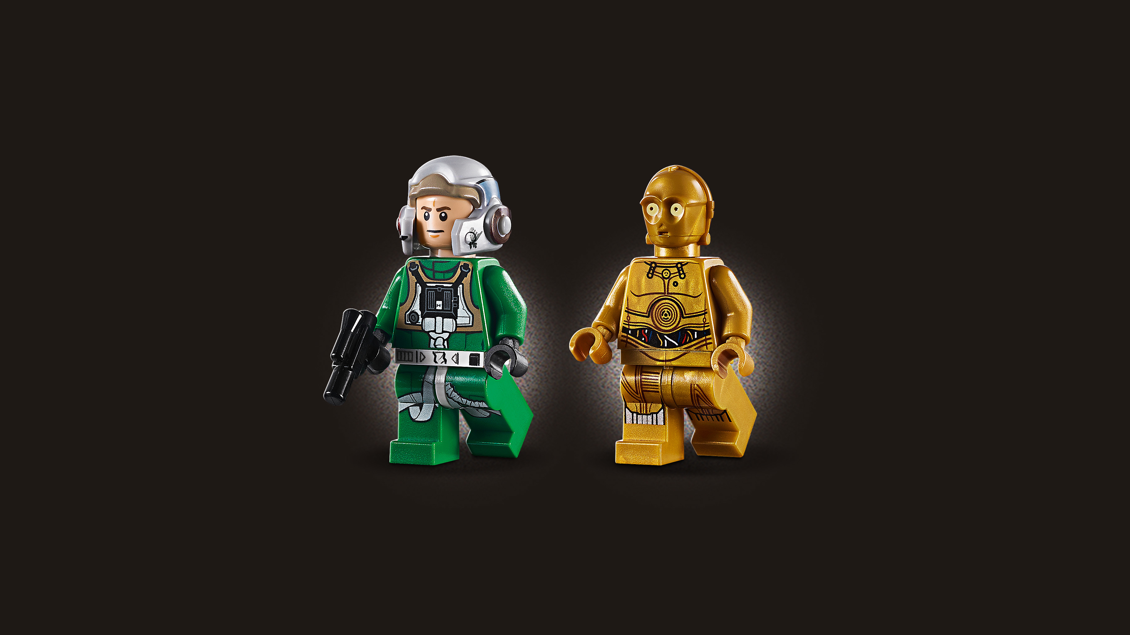 Dwie figurki Lego: pilot w zielonym mundurze i kasku oraz złoty C-3PO.