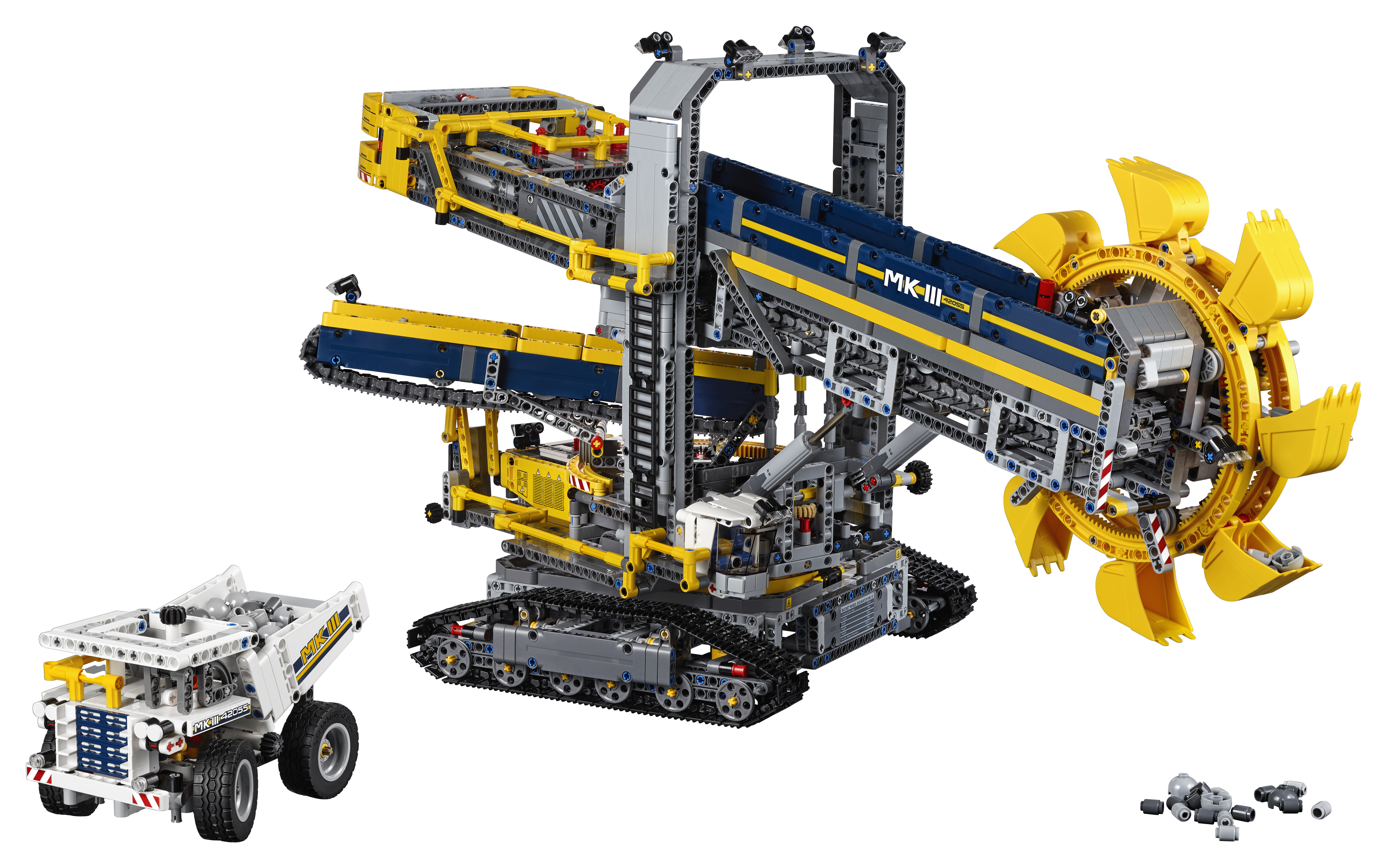 Zestaw Lego Technic z dużą żółtą koparką i mniejszym żółtym pojazdem.