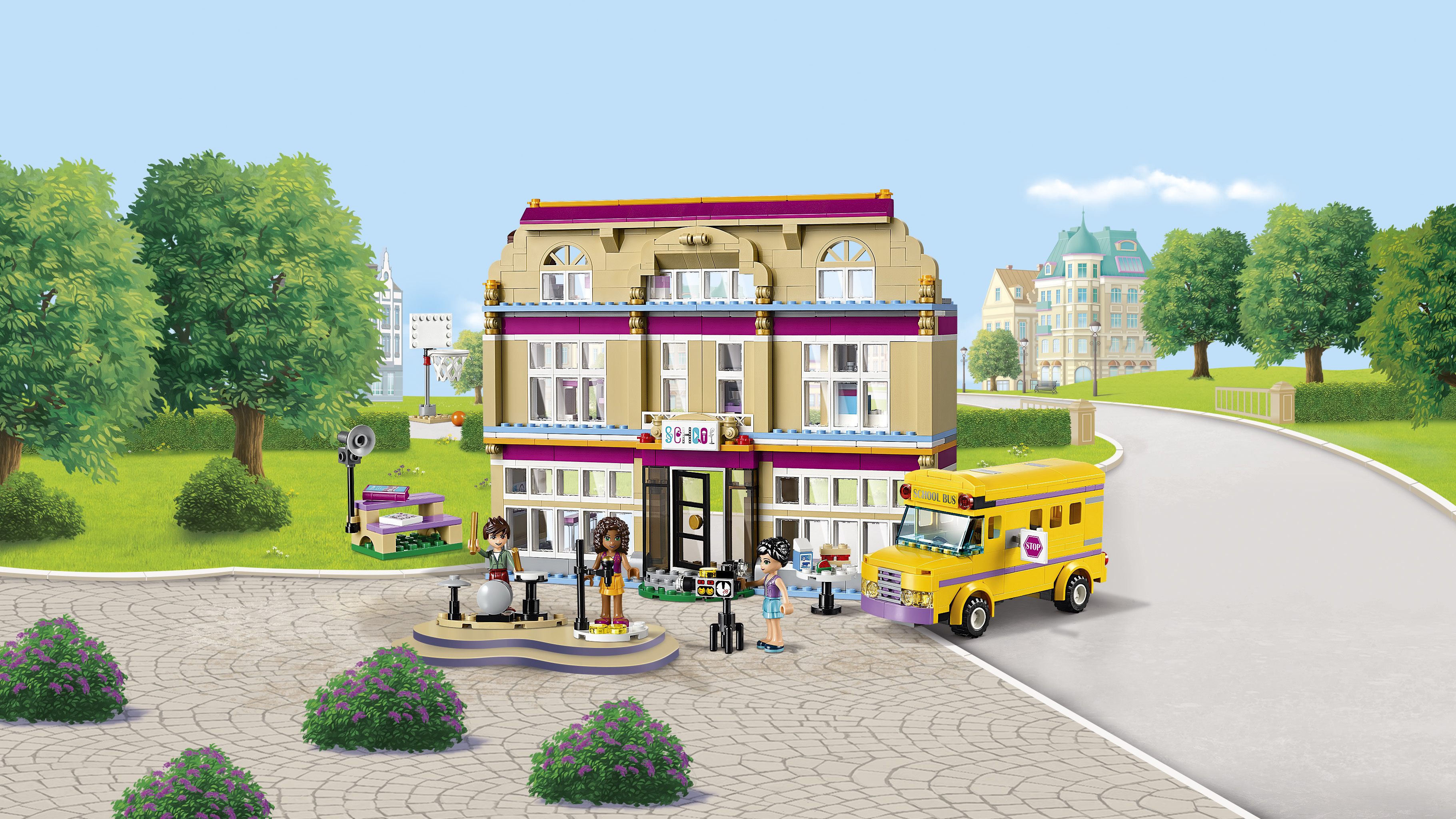 Zestaw Lego Friends. Zawiera budynek szkolny, szkolny autobus i różne figurki.