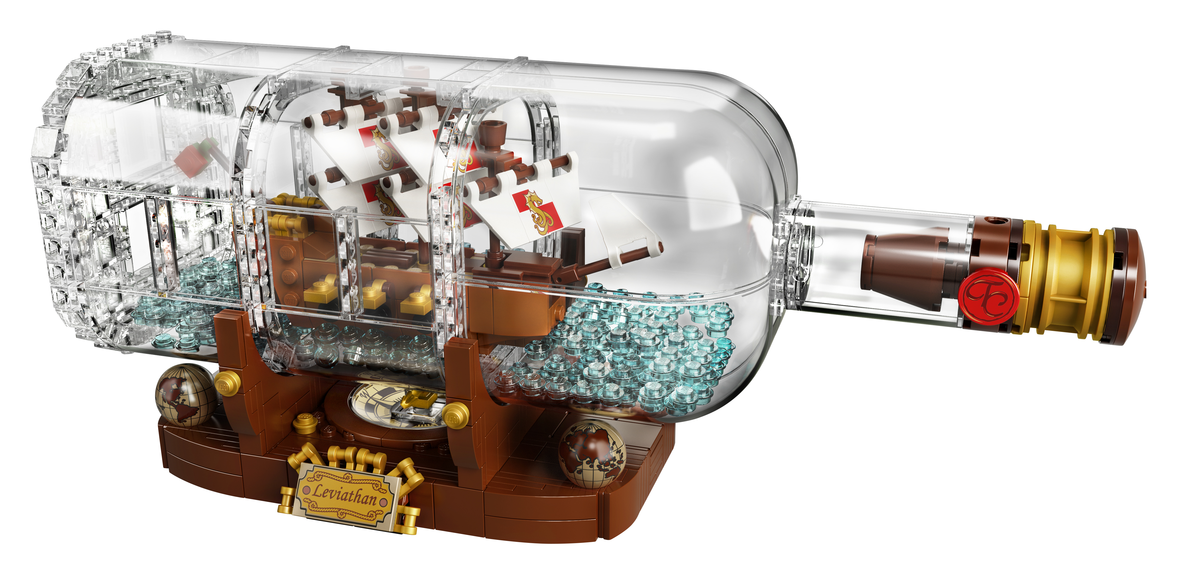 Lego ship in a bottle. A transparent bottle contains a ship with sails and a wooden stand.