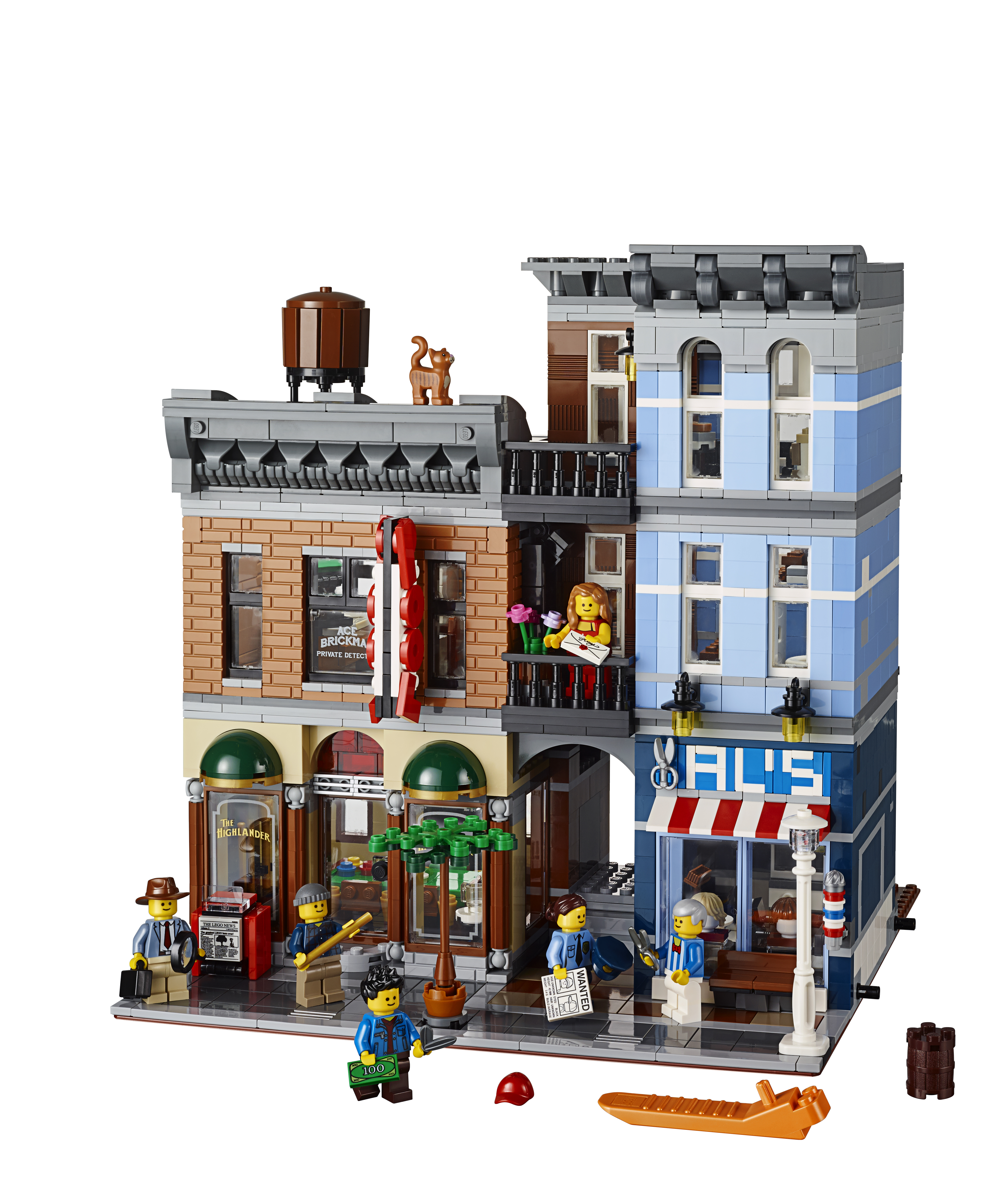 Set LEGO di una via cittadina con negozi, minifigure e dettagli come un serbatoio d'acqua e insegne stradali.