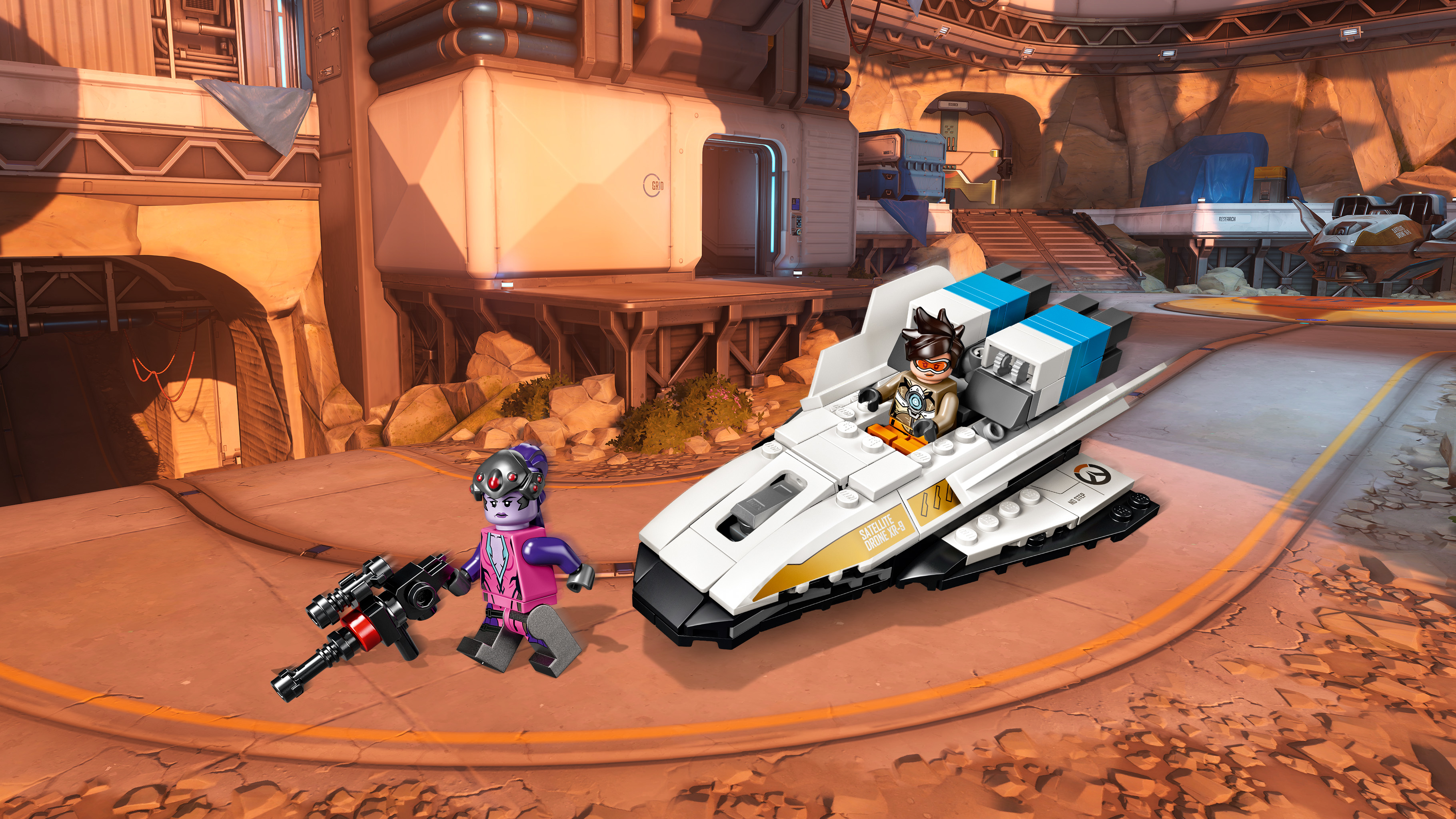 Set Lego con due personaggi e un'astronave bianca e blu. Lo sfondo mostra una città futuristica.