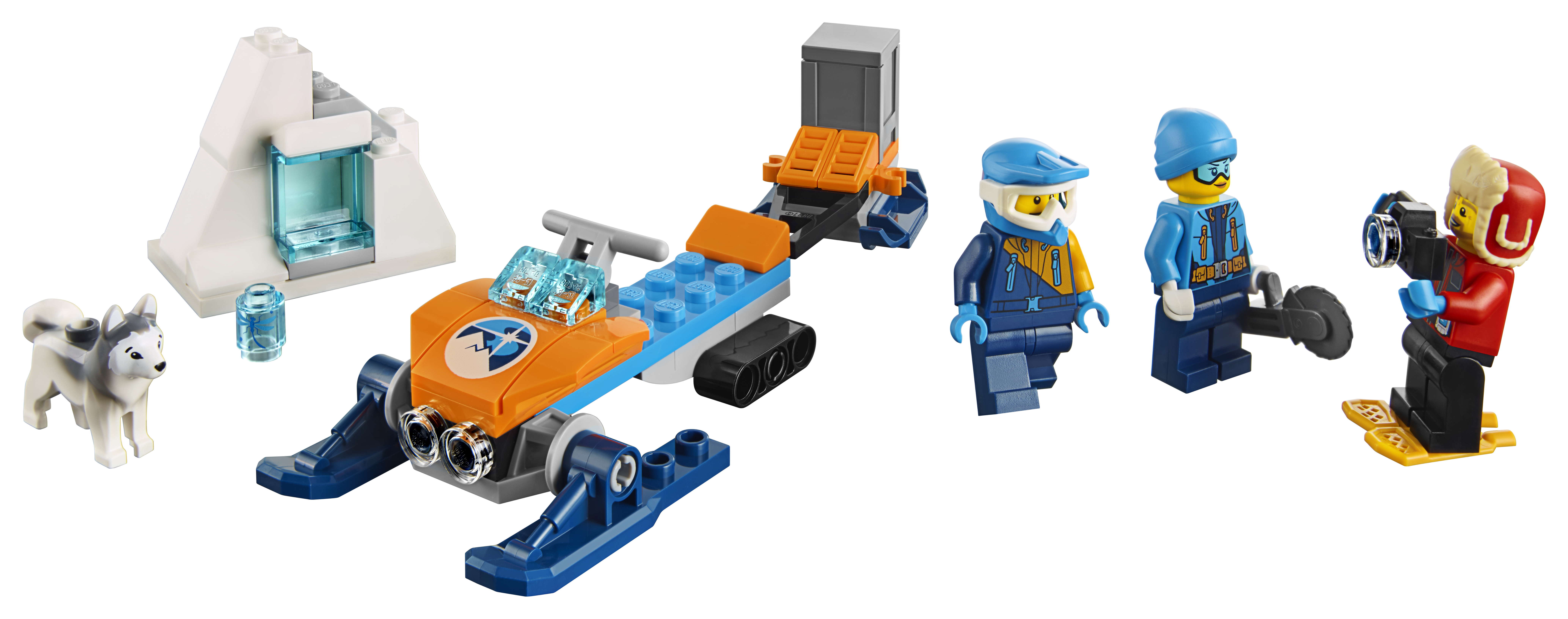 Bir Lego City Arctic seti, kar motosikleti, figürler, bir köpek ve bir iglo benzeri yapı ile.