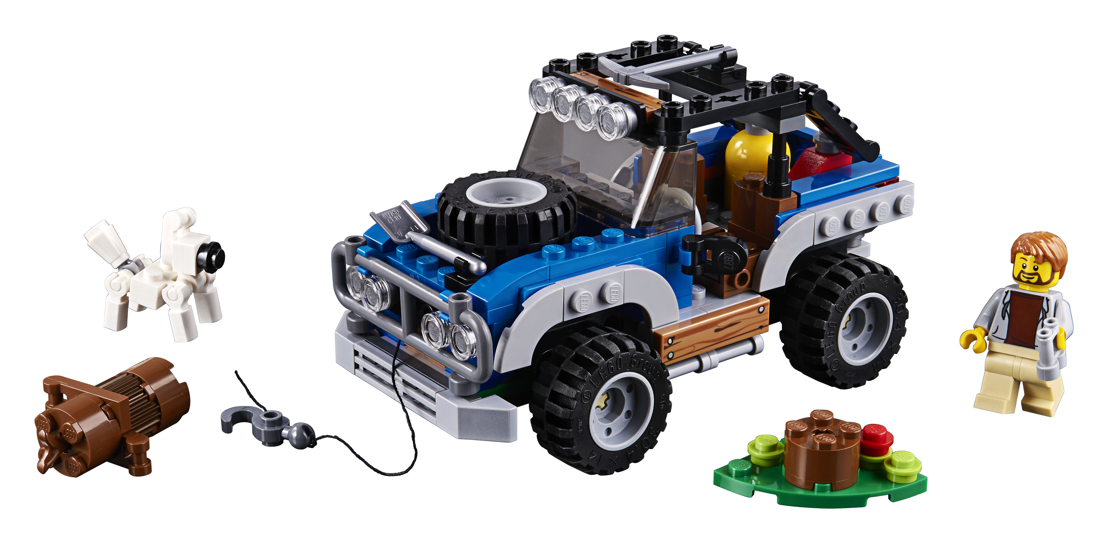 Zestaw Lego City 4x4 Off-Road. Niebieski pojazd terenowy, pies i mężczyzna są pokazani.