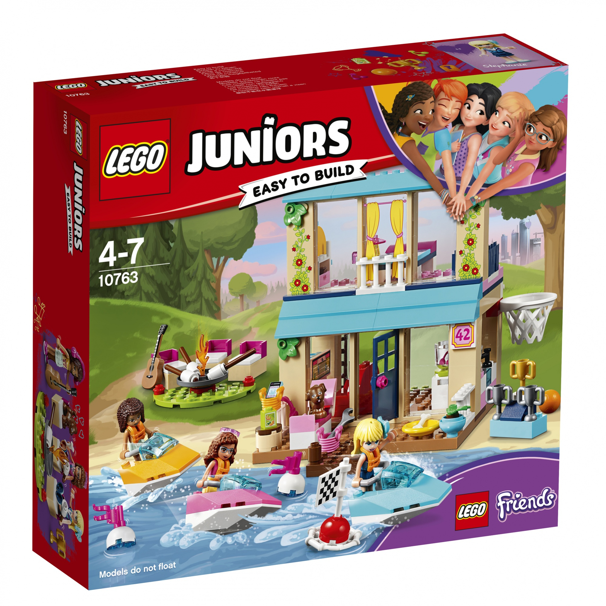Scatola del set LEGO Juniors. Mostra un edificio con tetto blu e ragazze che vanno in moto d'acqua in acqua.