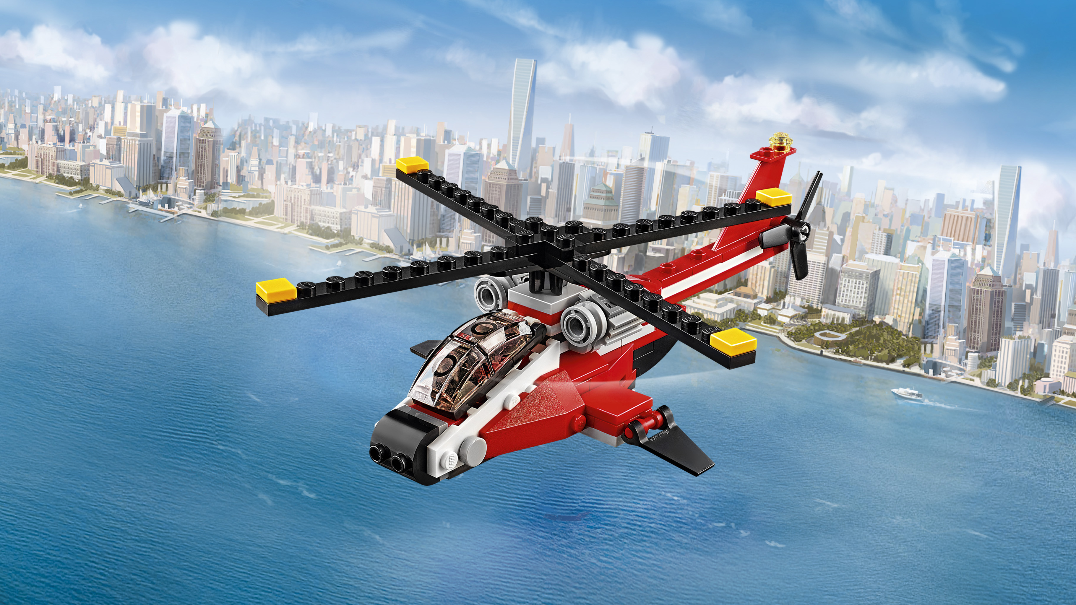 Helikopter Lego City w kolorze czerwono-białym lecący nad krajobrazem miejskim.