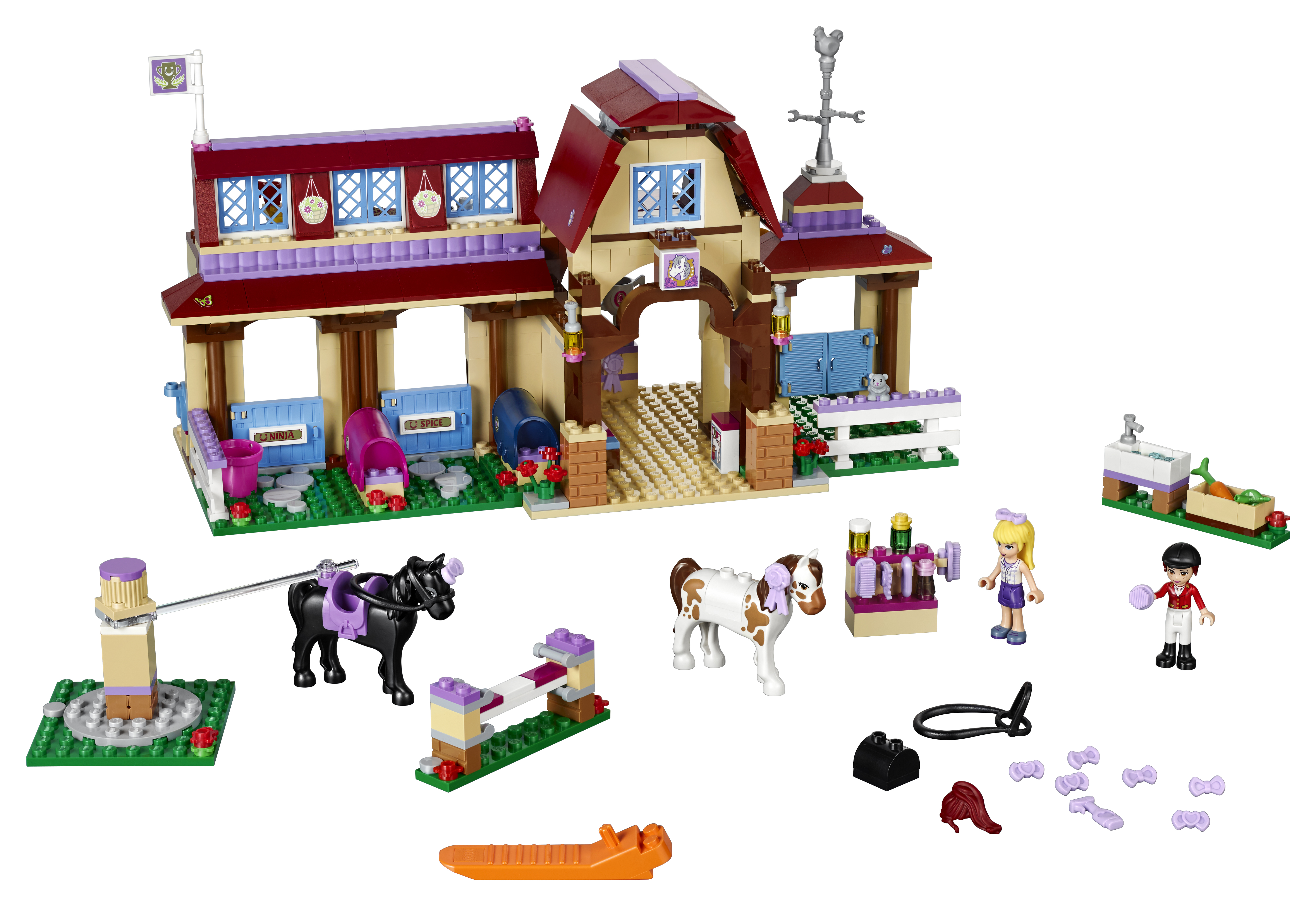 Zestaw Lego Friends ze stajnią. Zawiera stajnię, konie i postacie. Brązowy, fioletowy i biały.