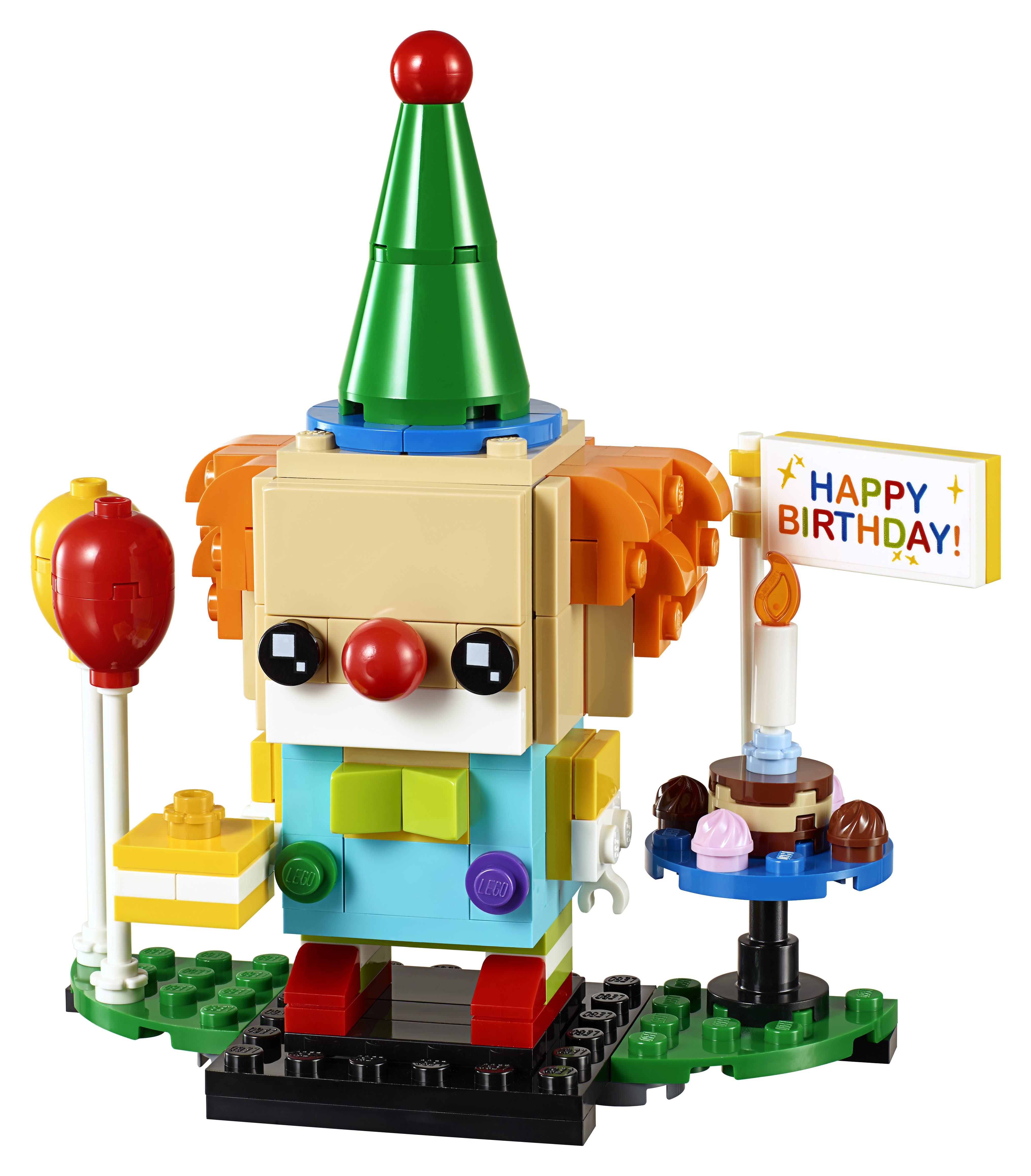 Een Lego clownfiguur met een verjaardagstaart, ballonnen en een bordje met 'HAPPY BIRTHDAY!'