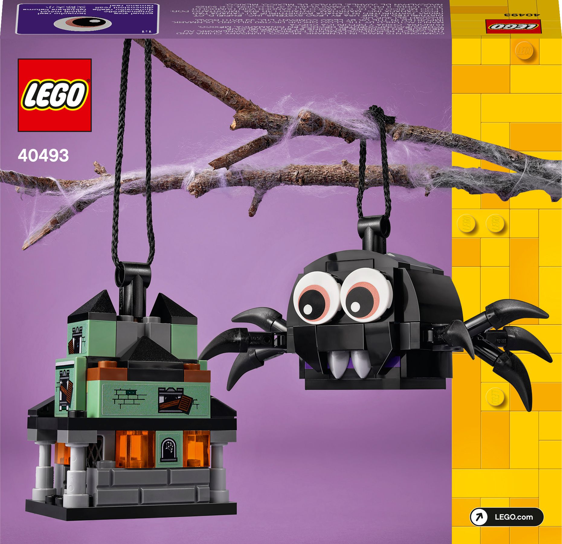 Ornamenti LEGO di Halloween: un ragno nero e una casa infestata appesi a un ramo.