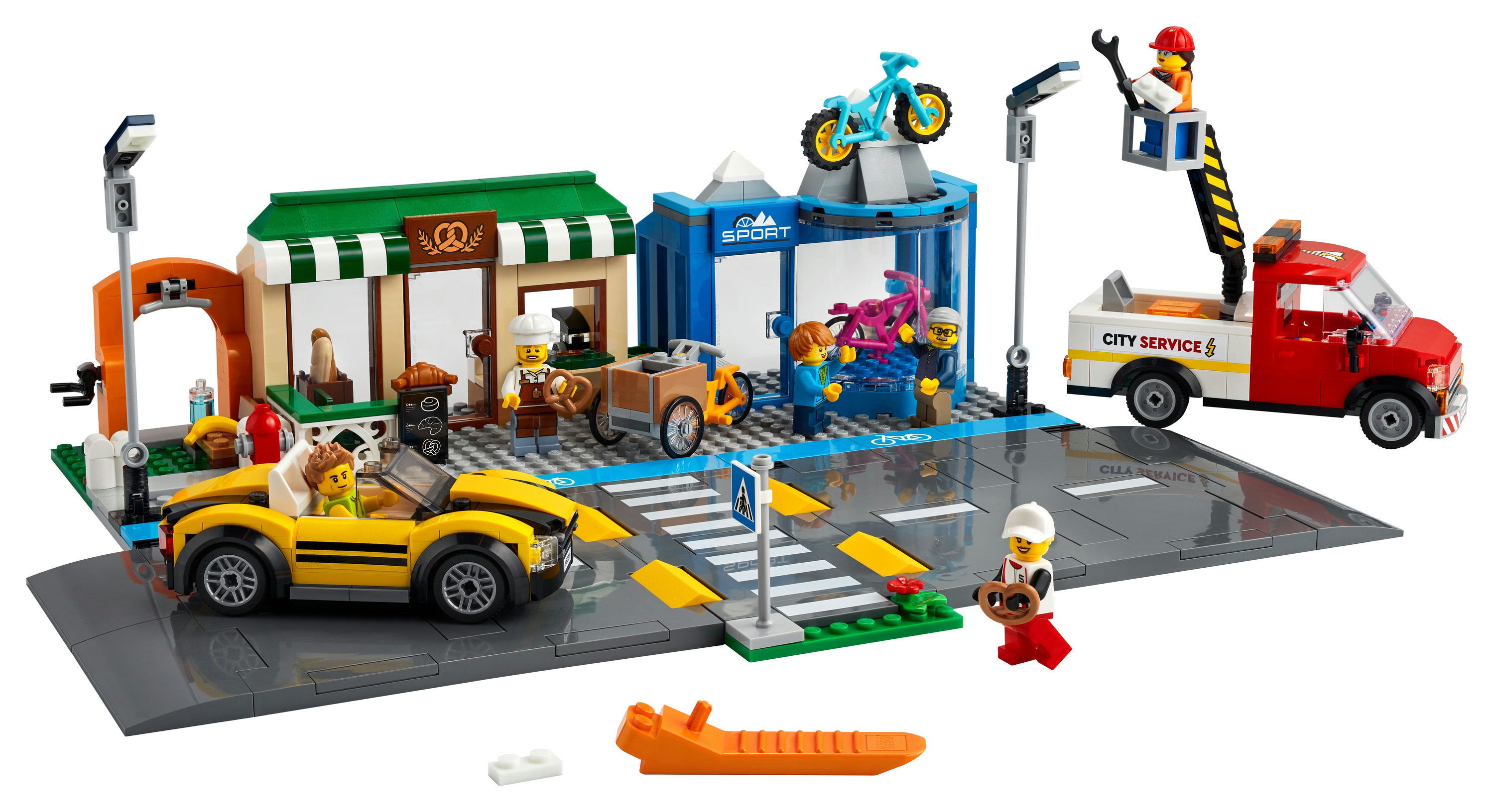 LEGO City seti, araçlar ve figürlerle sokak sahnesi.