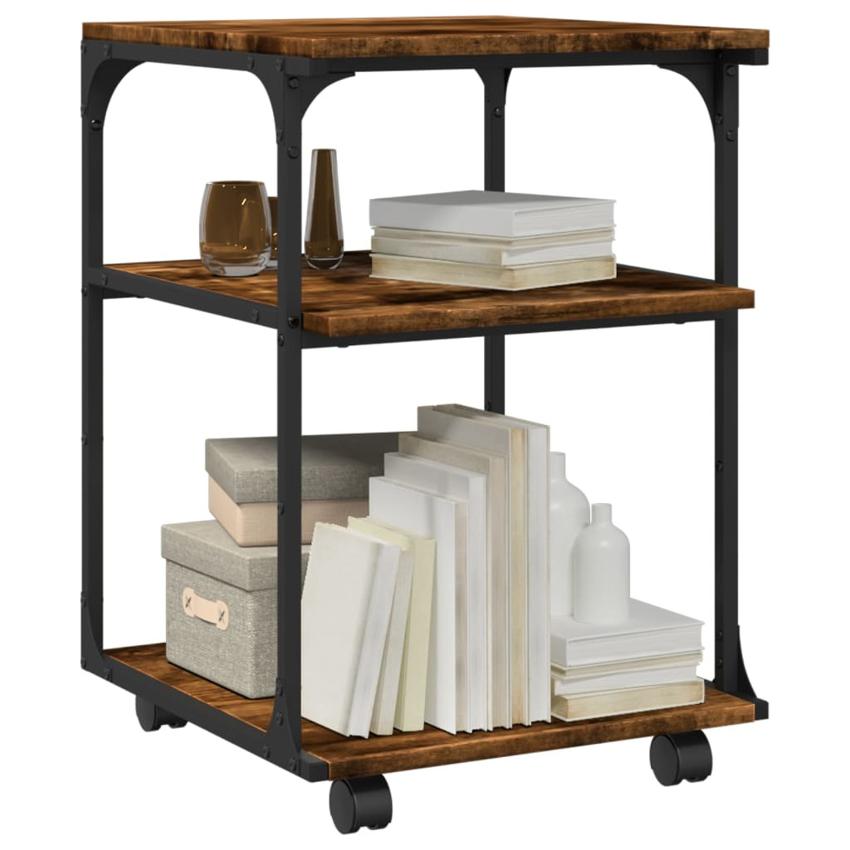 Ein dreistöckiger Rollwagen mit Büchern, Kisten und Dekorationsartikeln auf Holzregalen.